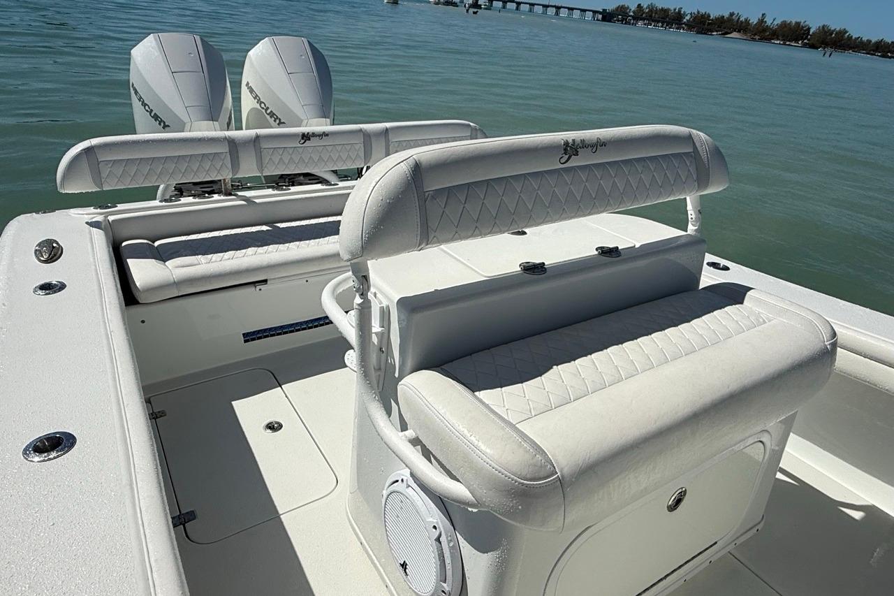 2017 Yellowfin 26 Hybrid boat with dual Mercury engines on calm water.