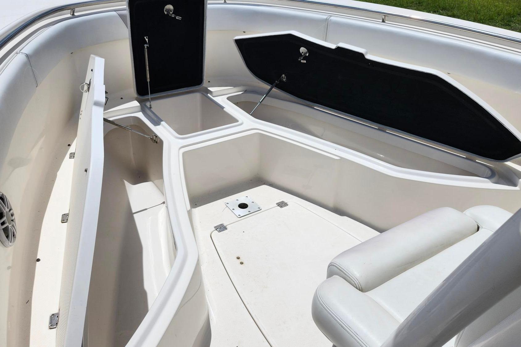 2015 Robalo R300 Center Console boat interior with open storage compartments.