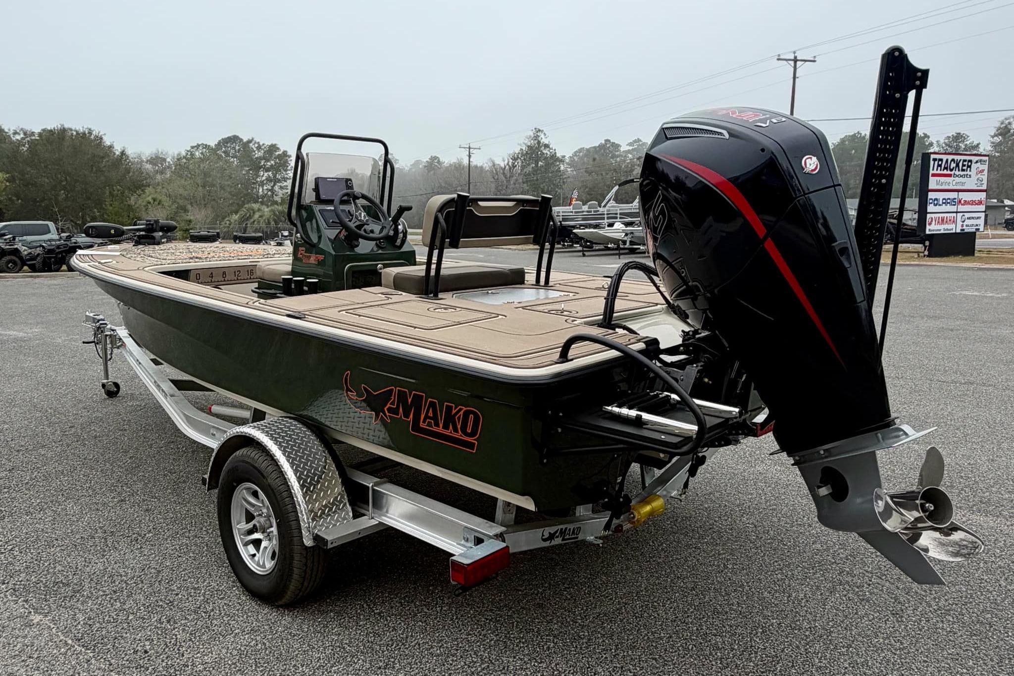2025 Mako 18 Pro Skiff Backwater Edition boat on trailer, featuring powerful outboard motor.