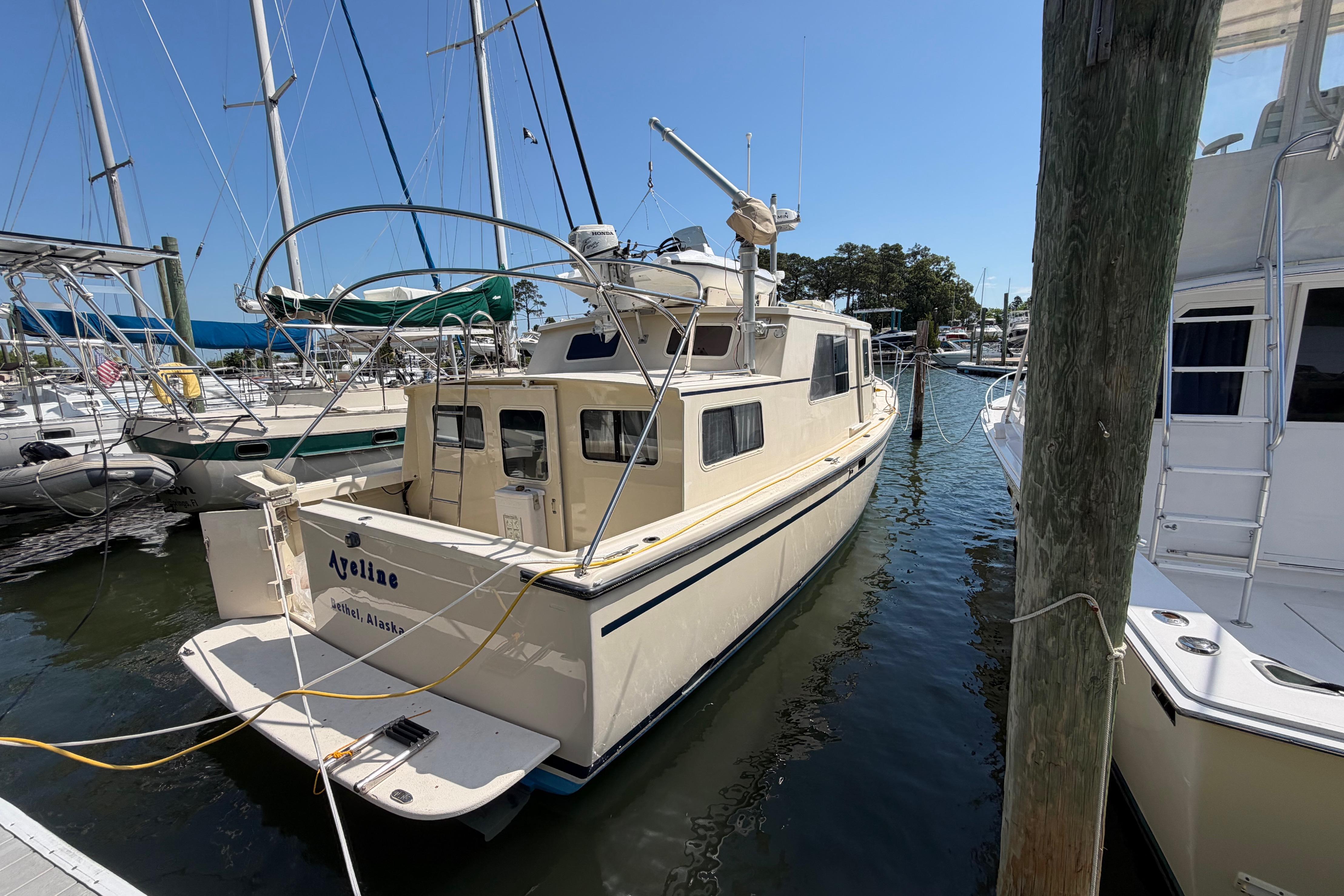 1997 Rosborough Trawler docked at marina, featuring classic design and sturdy build.
