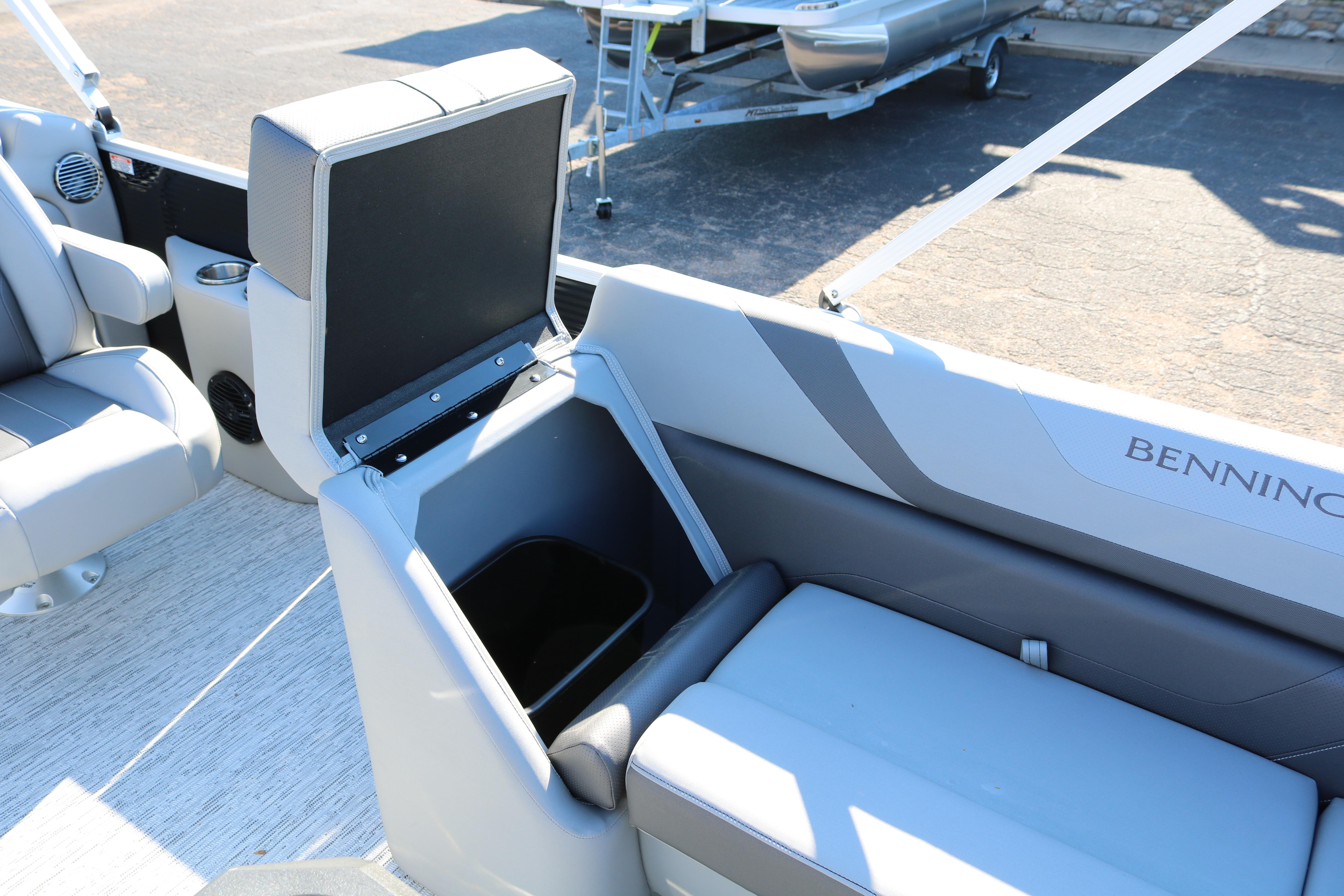 2026 Bennington 22SX Stern Radius boat interior with open storage compartment.
