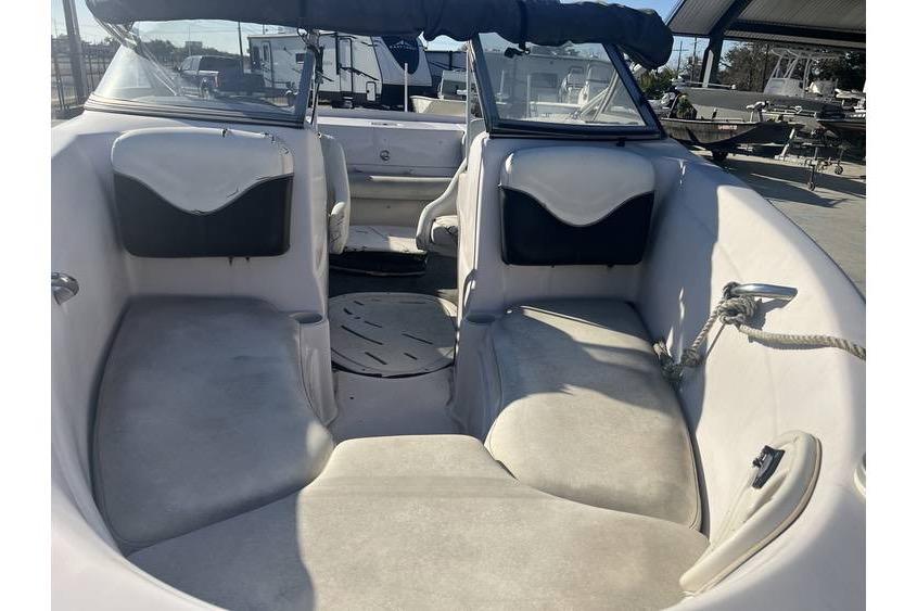 Interior view of a 2006 Tahoe 206 boat, featuring spacious seating and a clean design.