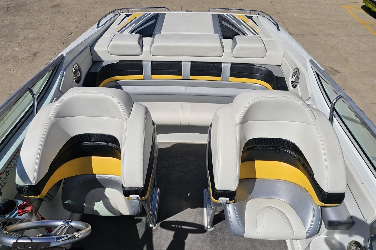 2014 Formula 292 FASTech boat interior with white, black, and yellow seating.