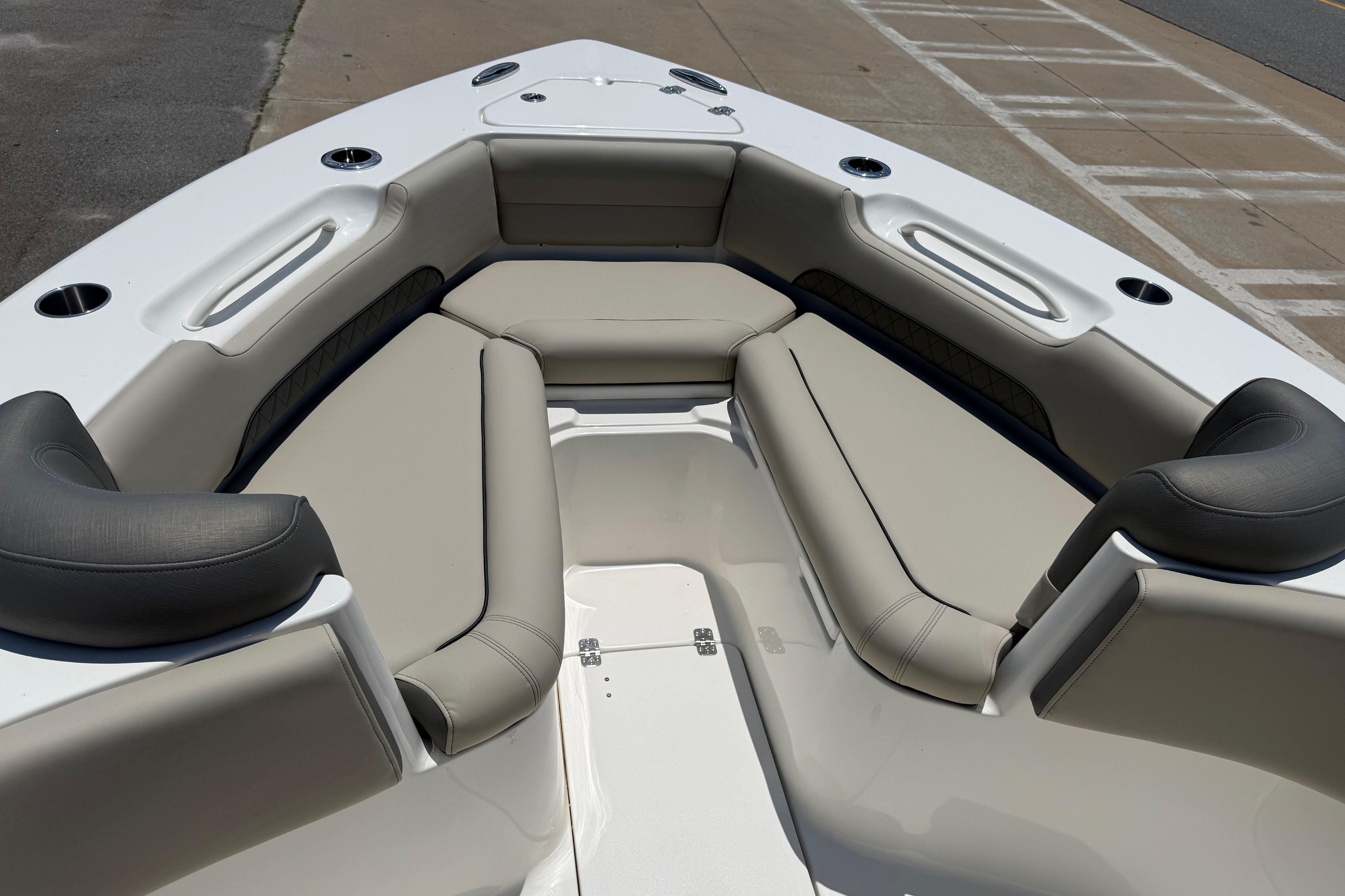 2027 Key West 249 FS boat interior with cushioned seating and cup holders.