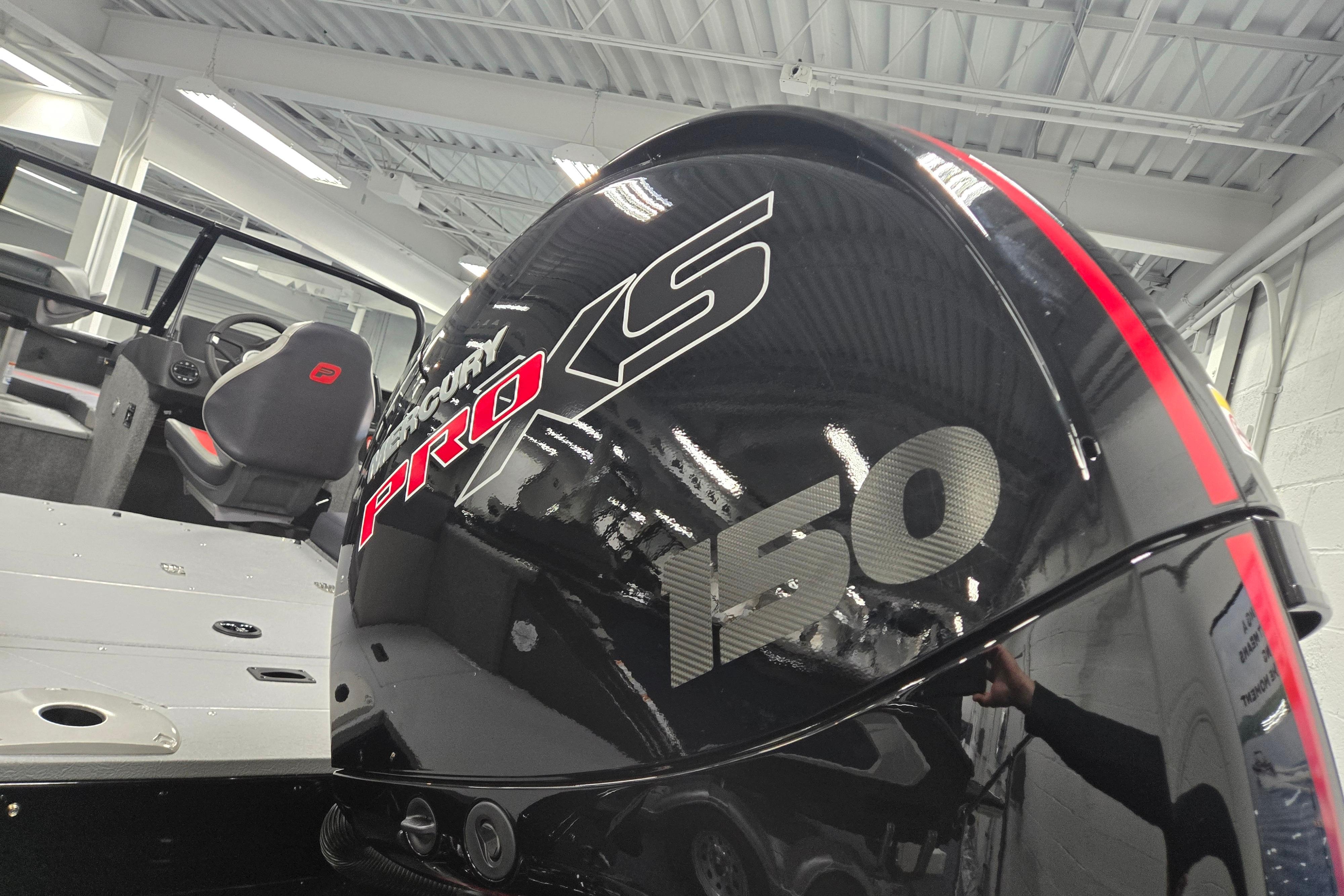 2026 Princecraft Sport 175 boat with Mercury Pro XS 150 engine in showroom.