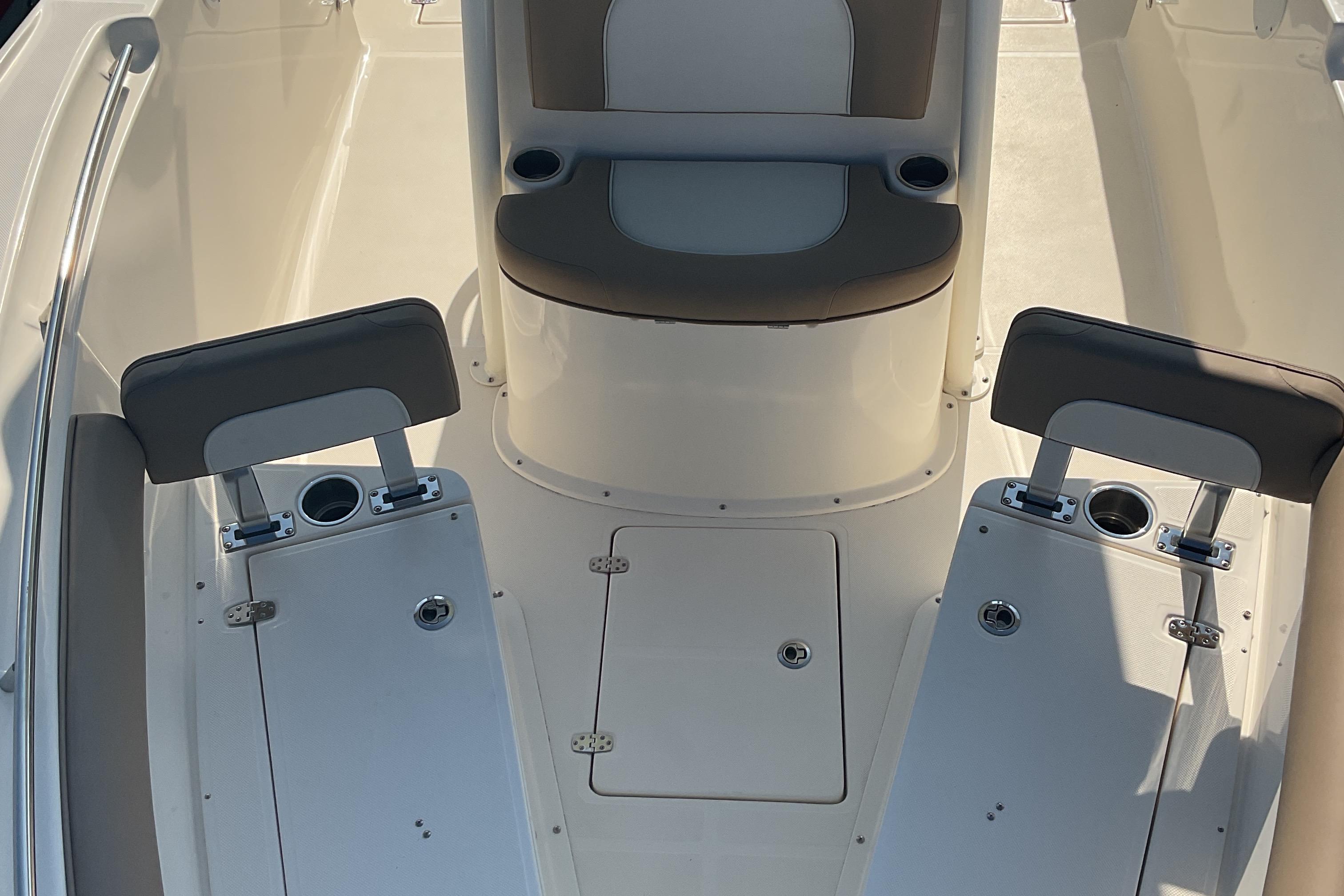 2023 Sea Born SX239 Offshore boat interior with seating and cup holders.