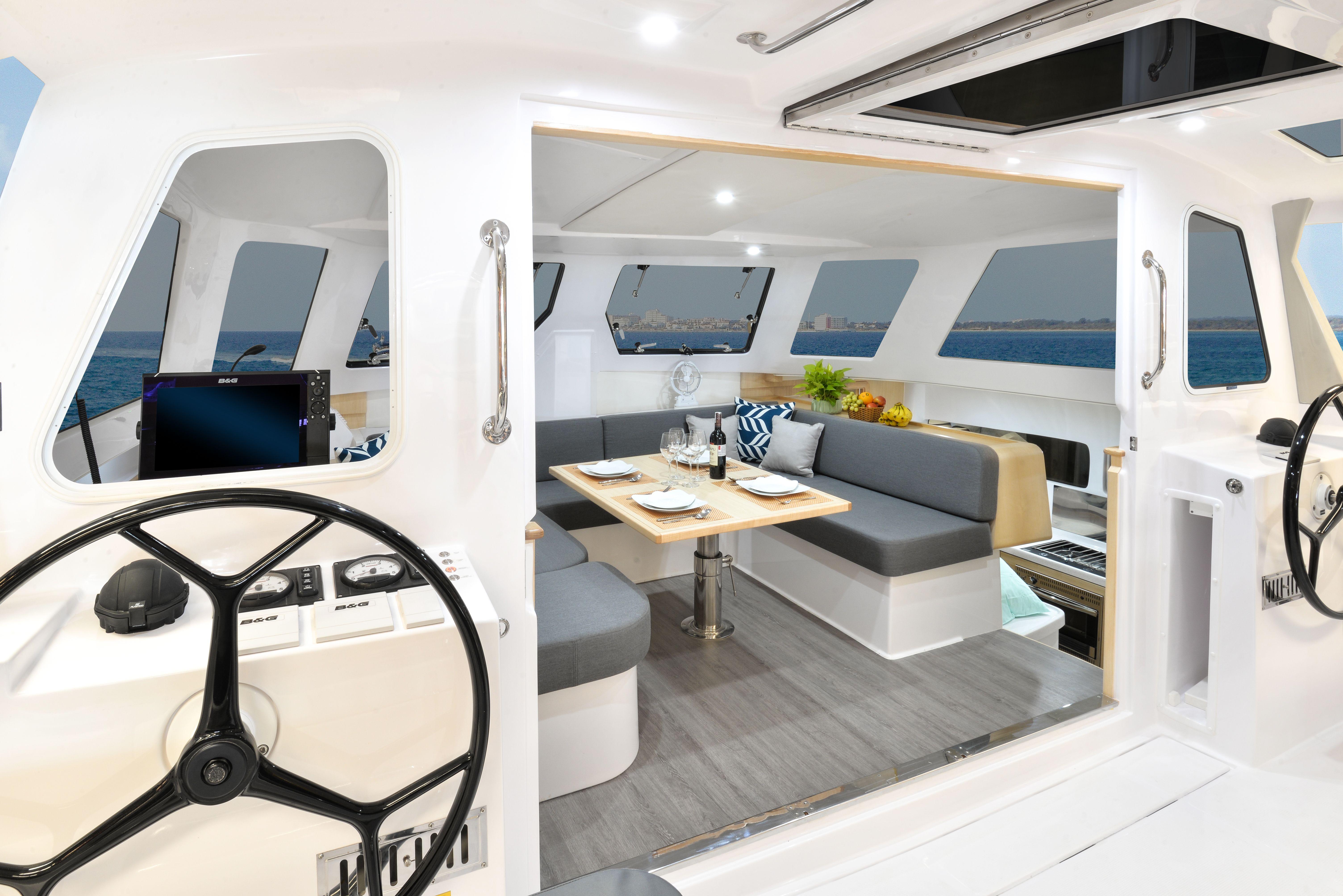 Interior of 2025 Seawind 1170 catamaran with modern seating and dining area.