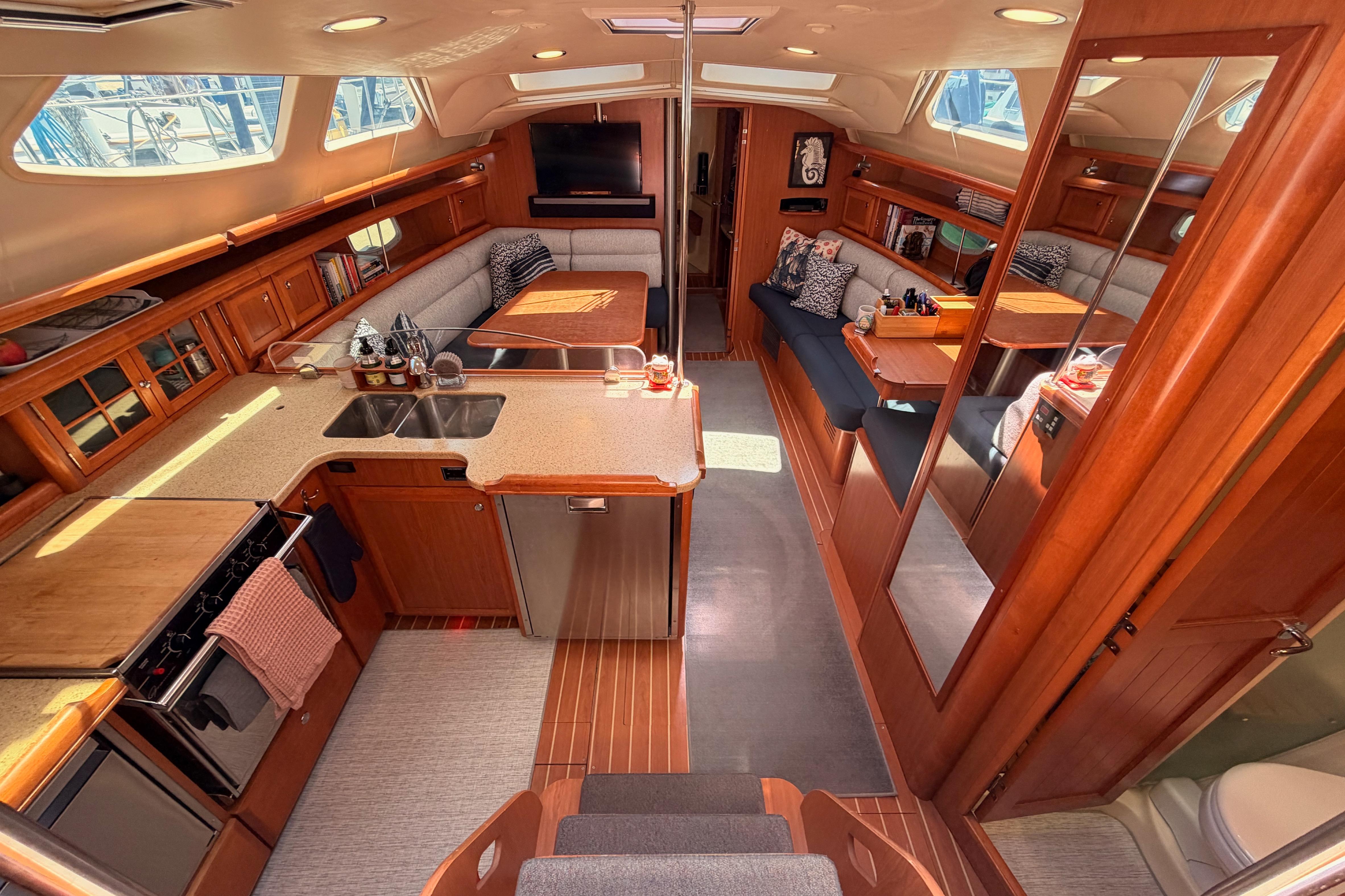 Luxurious interior of 2008 Hunter 45 Deck Salon yacht with spacious seating and modern amenities.