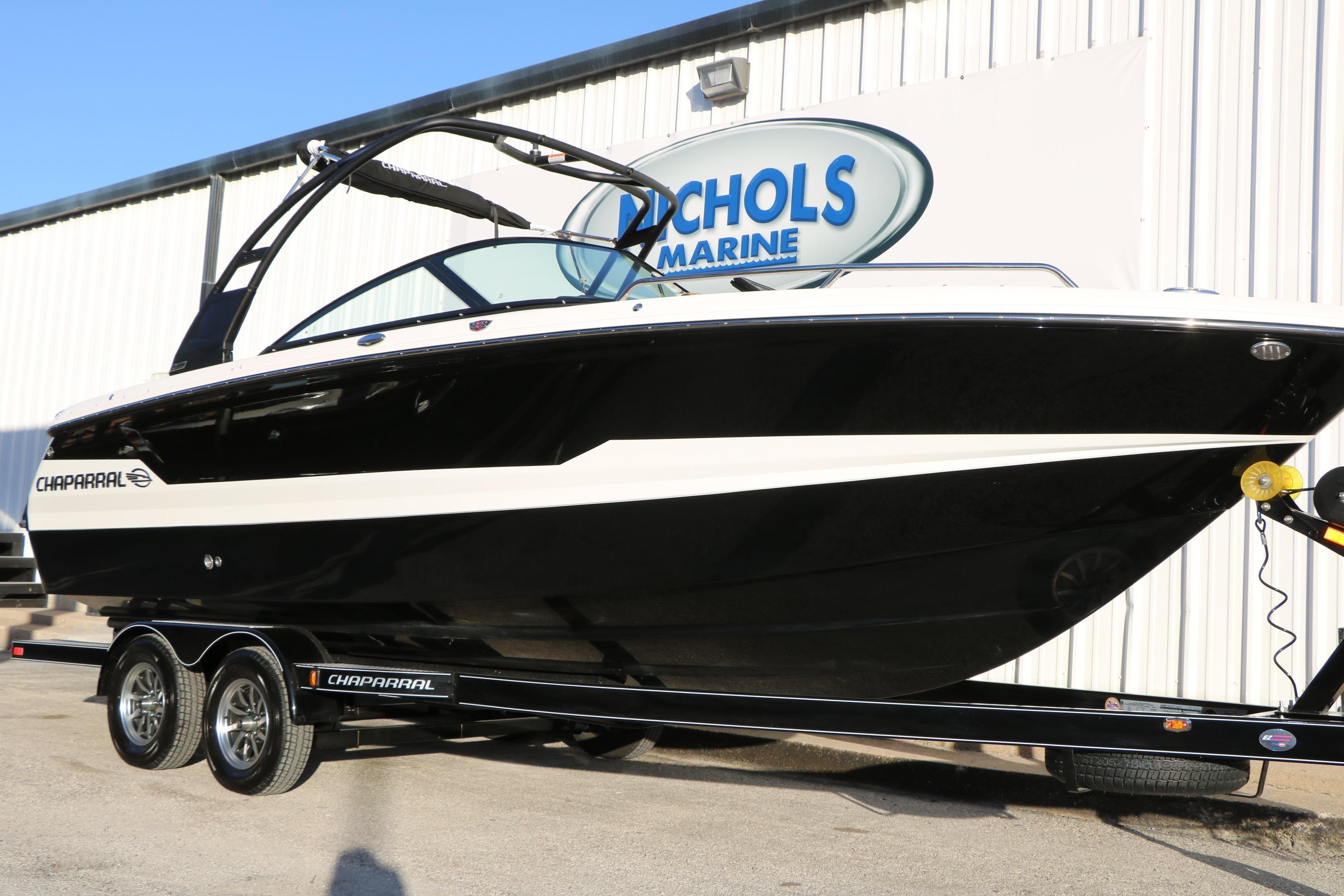 2026 Chaparral 247 SSX boat on trailer at Nichols Marine dealership.