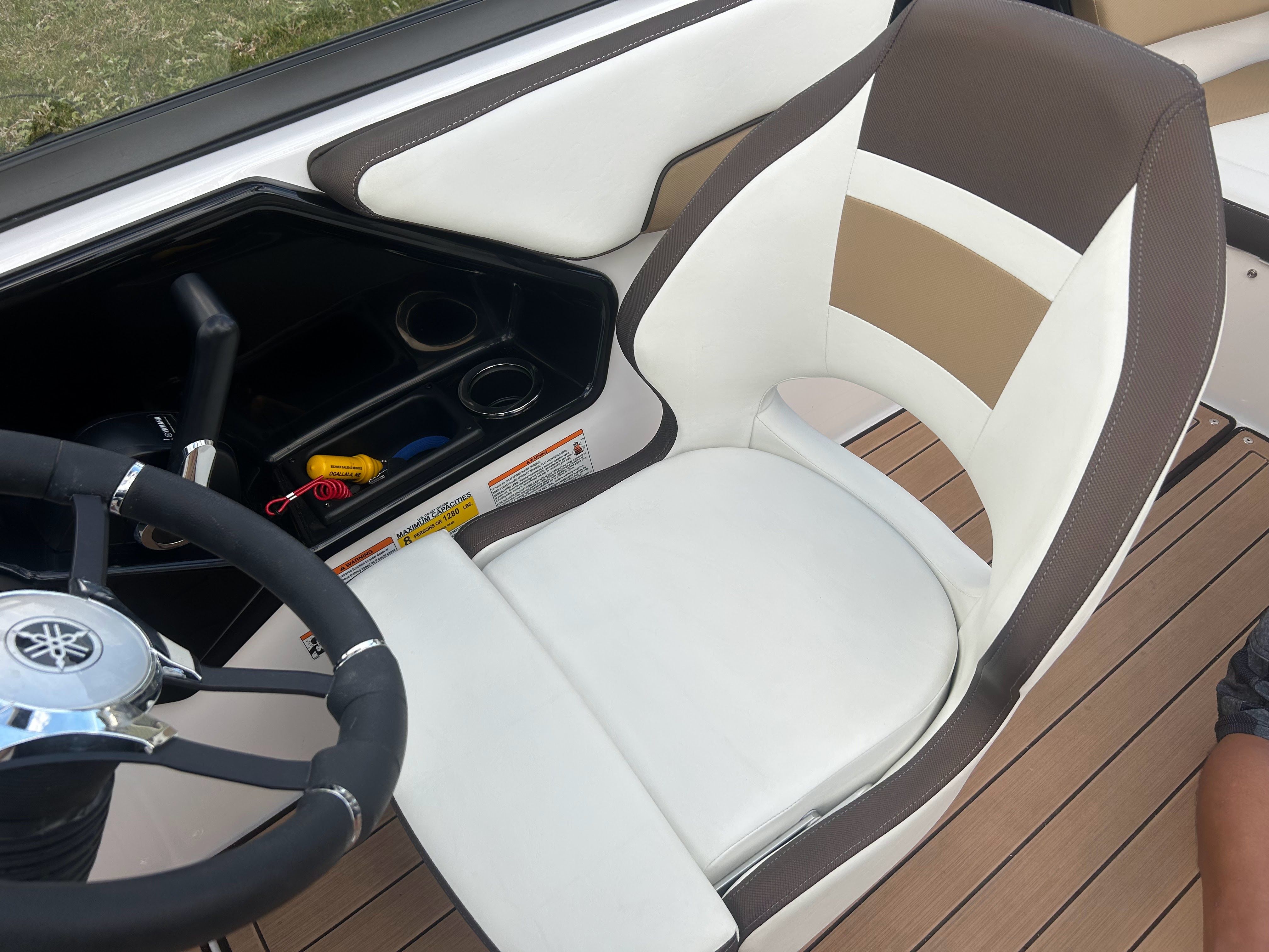 Interior of a 2022 Yamaha Boats 195S with steering wheel and seat.