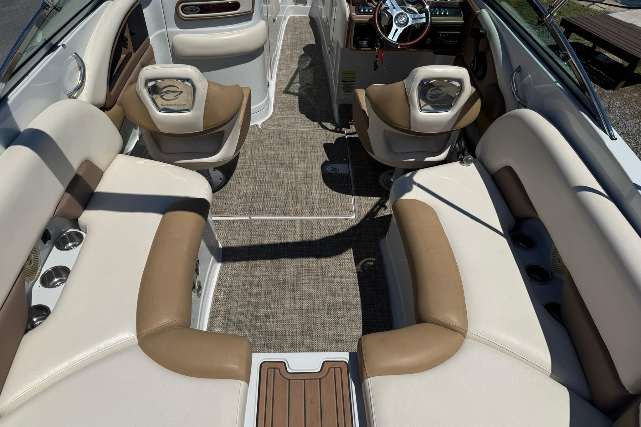 Interior of a 2016 Crownline 255 SS boat with beige and brown seating.