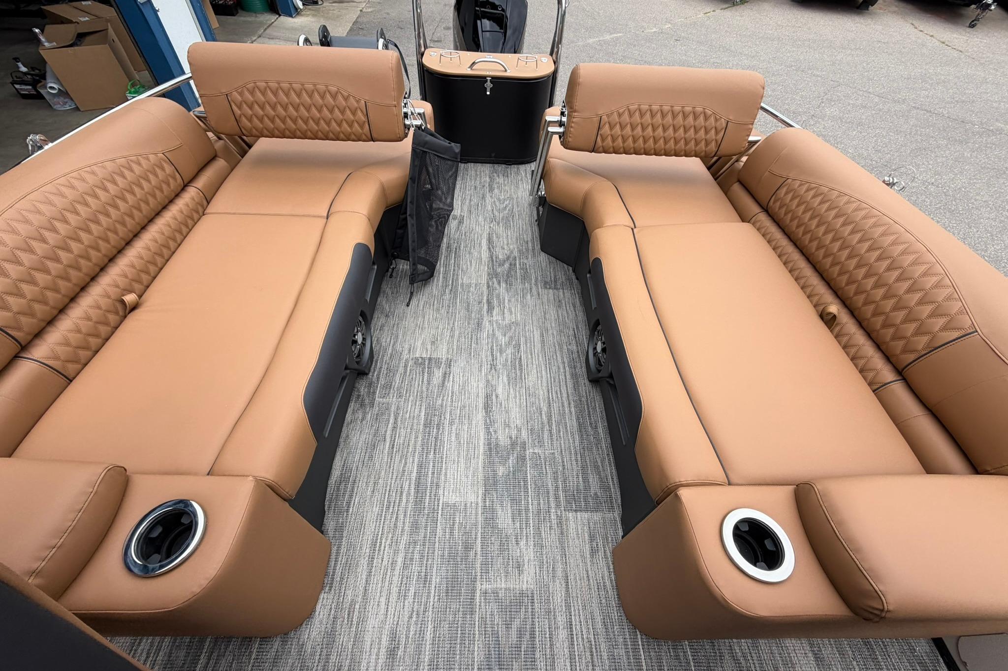 Luxurious interior of 2026 Avalon Catalina Quad Lounge Shift boat with tan leather seating.
