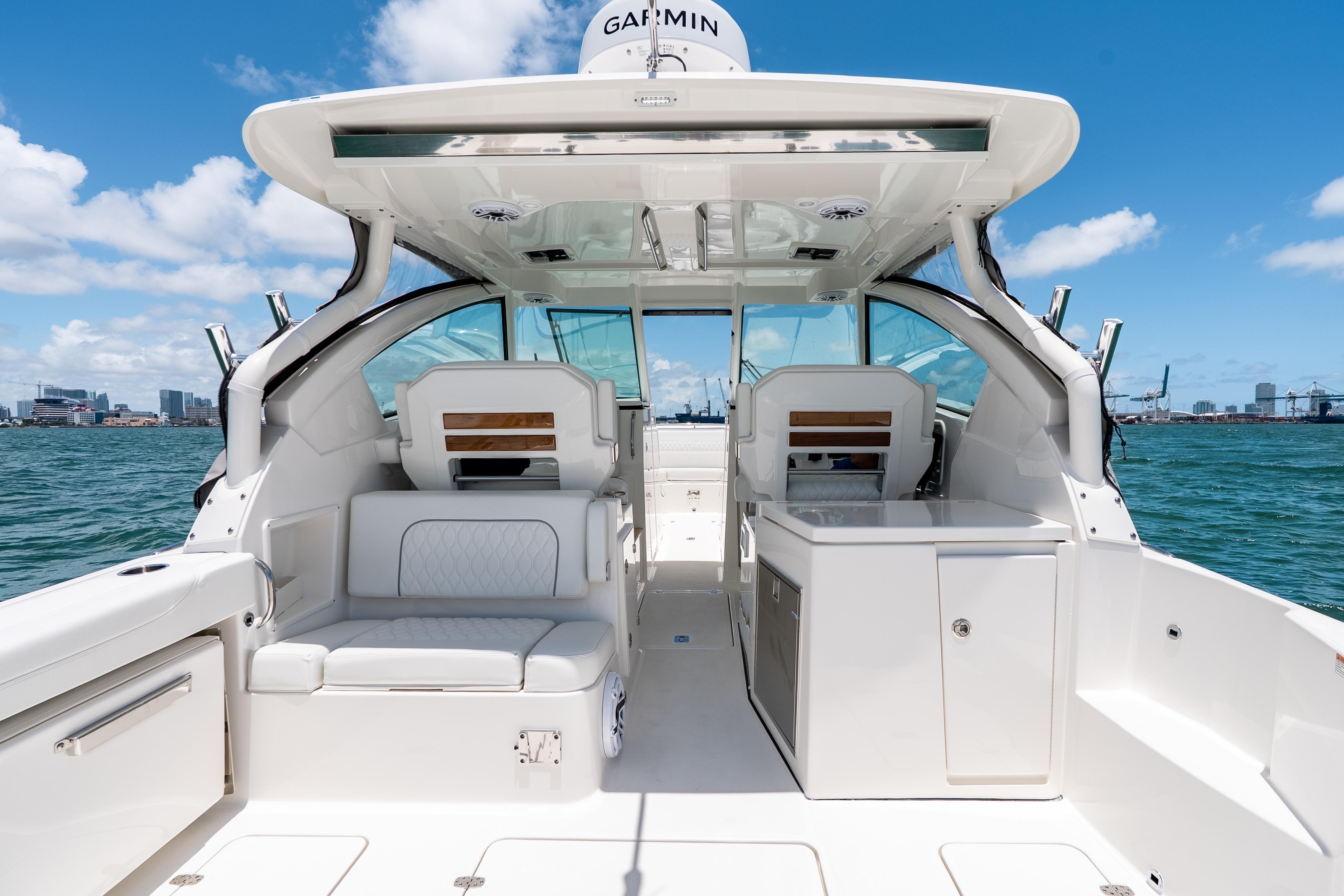 2026 Pursuit DC 326 Dual Console boat interior with seating and ocean view.