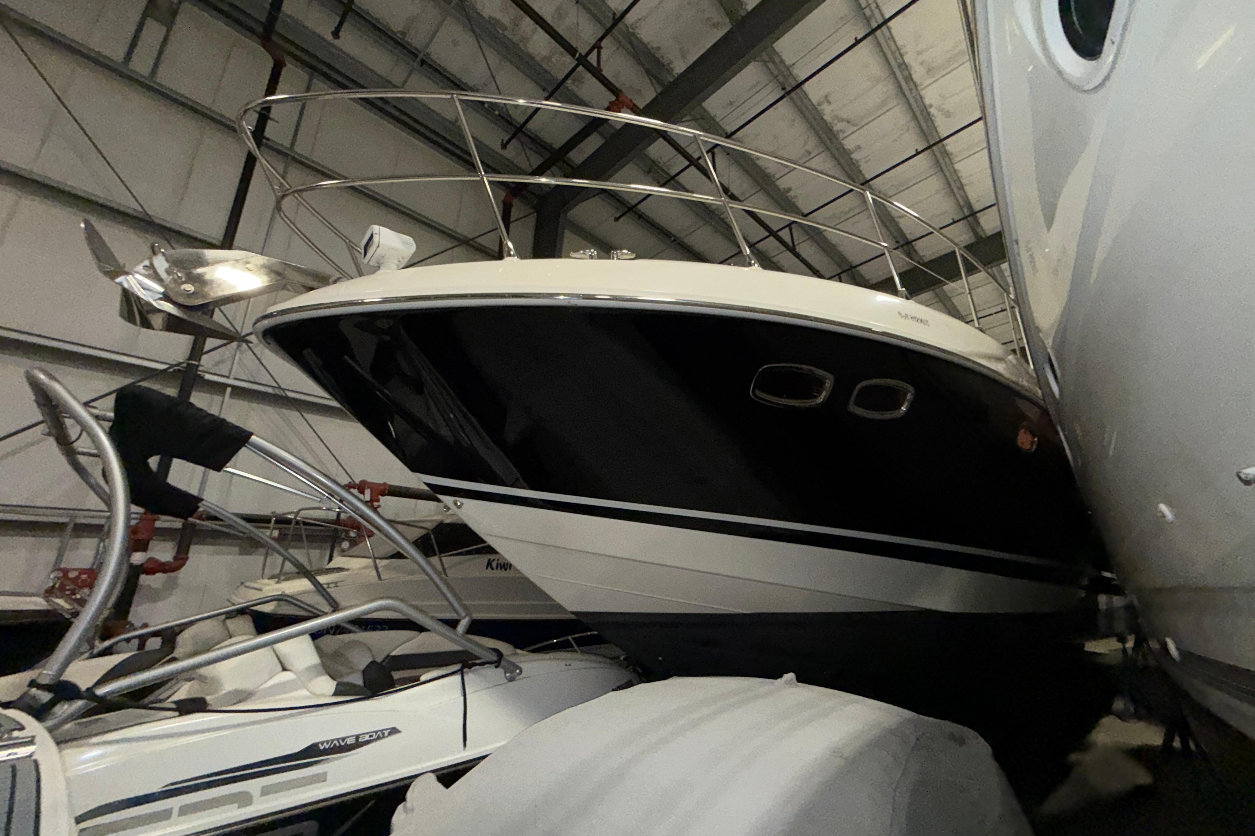 2008 Sea Ray 55 Sundancer yacht in storage, showcasing sleek design and modern features.