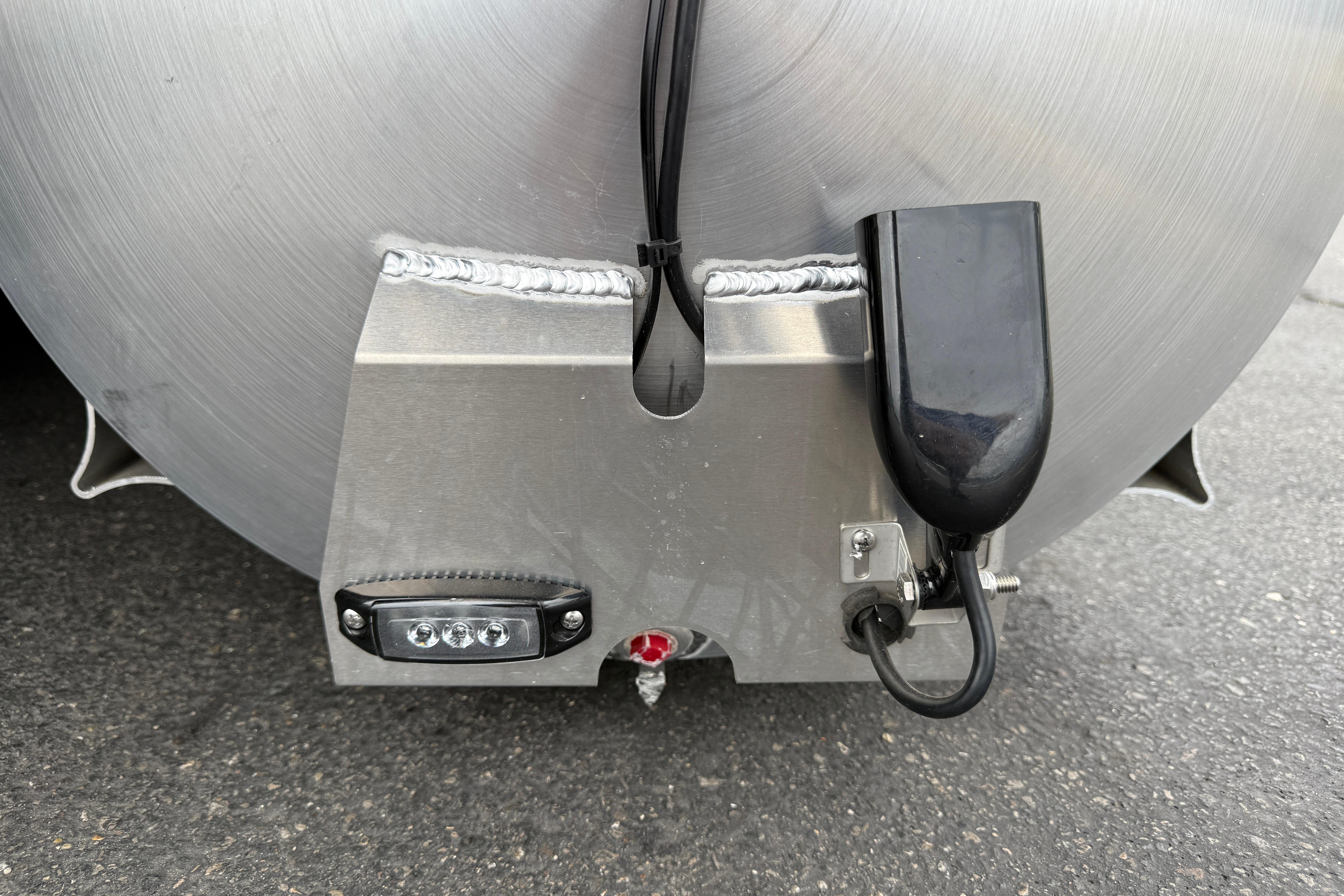 Close-up of 2026 Bentley Pontoons Elite 253 Admiral pontoon detail with wiring and light.