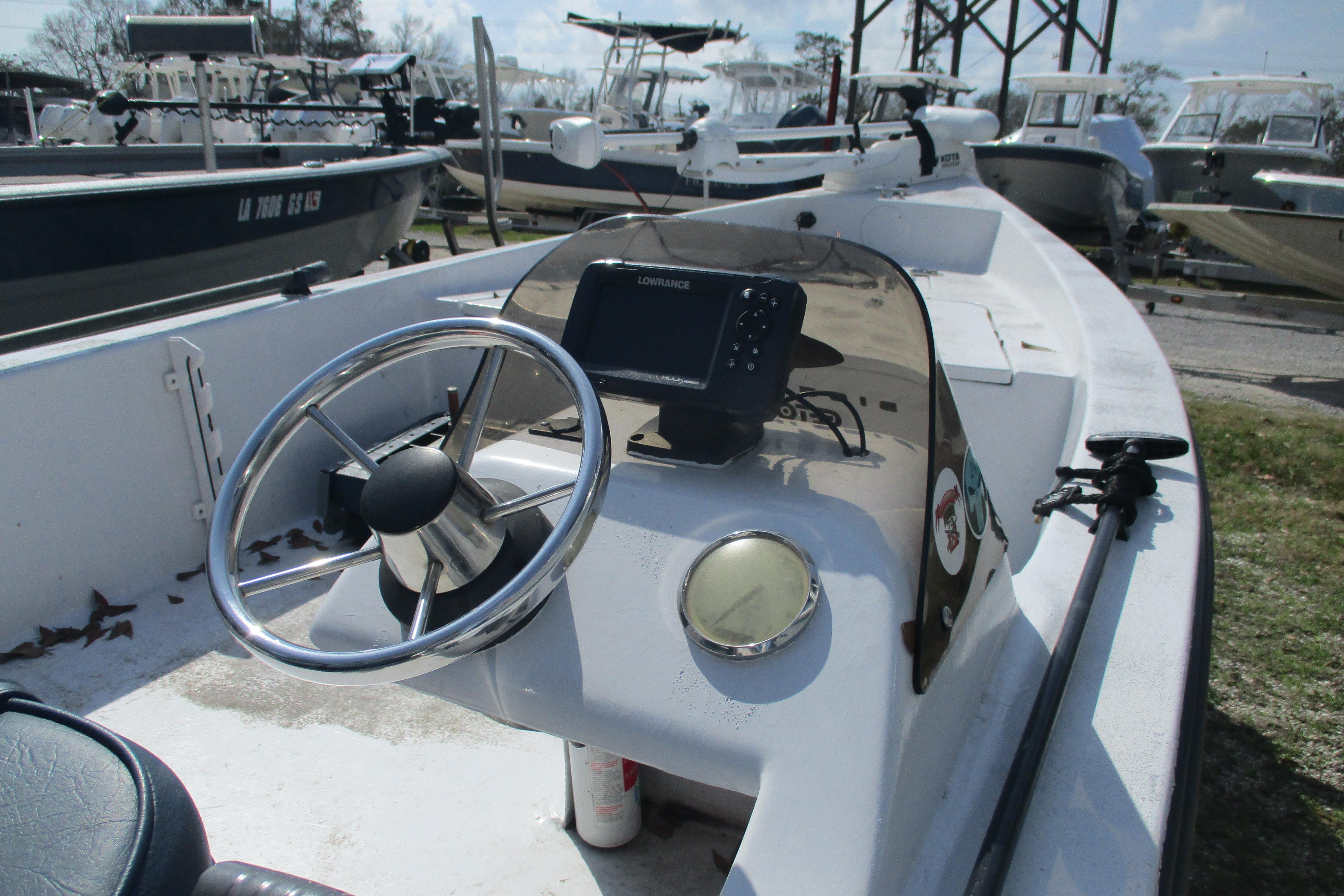 2012 Stumpknocker 17 SPORT boat with steering wheel and navigation equipment.