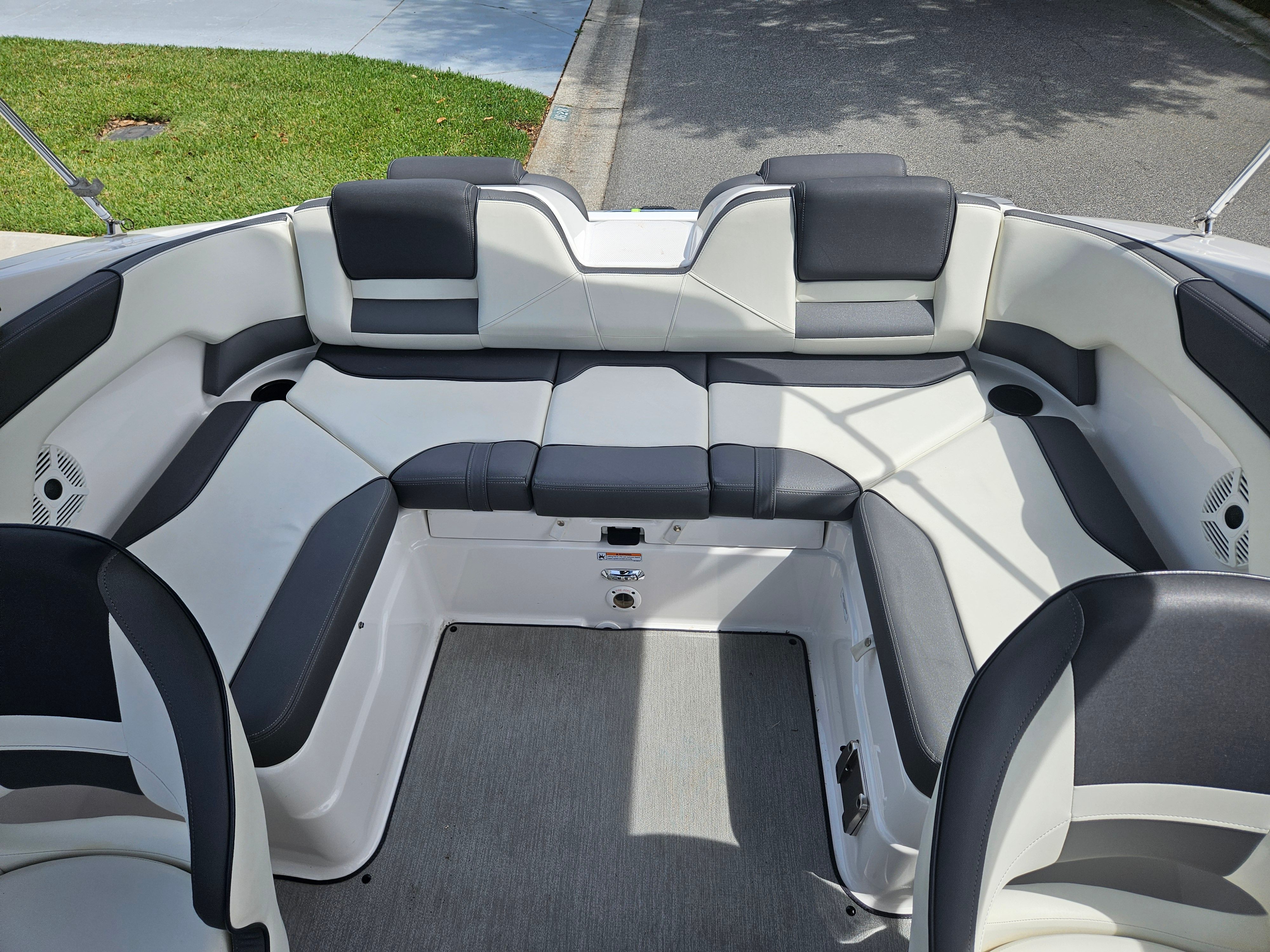 Interior of a 2022 Yamaha SX210 boat with gray and black seating.