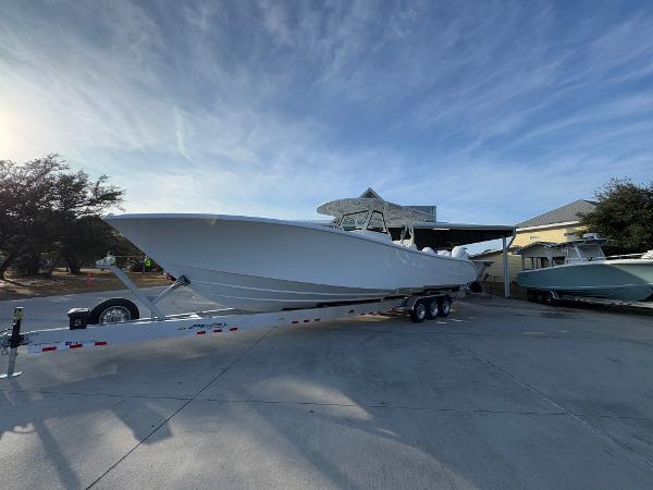 2025 Yellowfin 39 Offshore boat on trailer under clear sky.