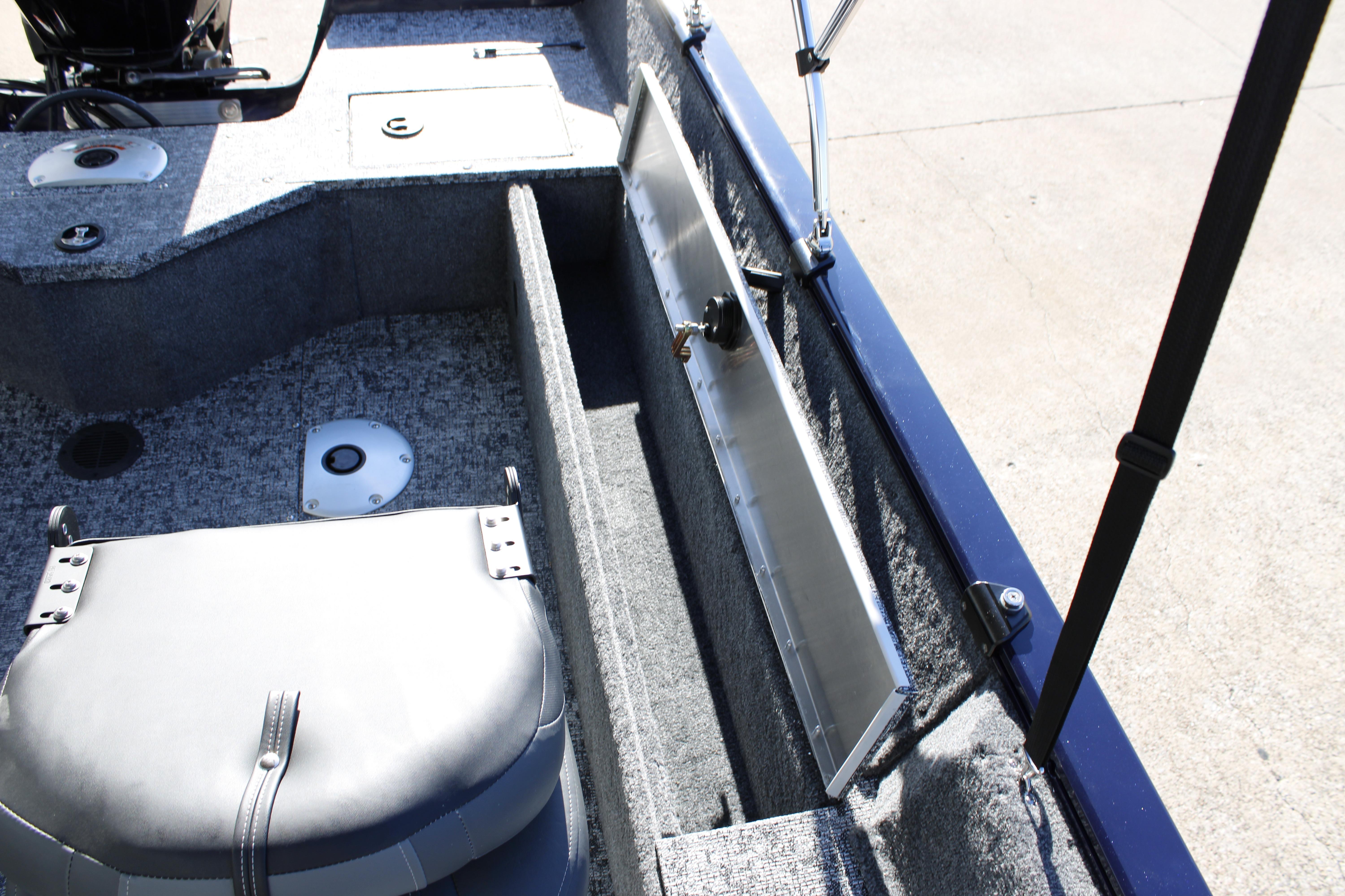 2026 Tracker Pro Guide V-16 SC boat interior with storage compartments and seating.