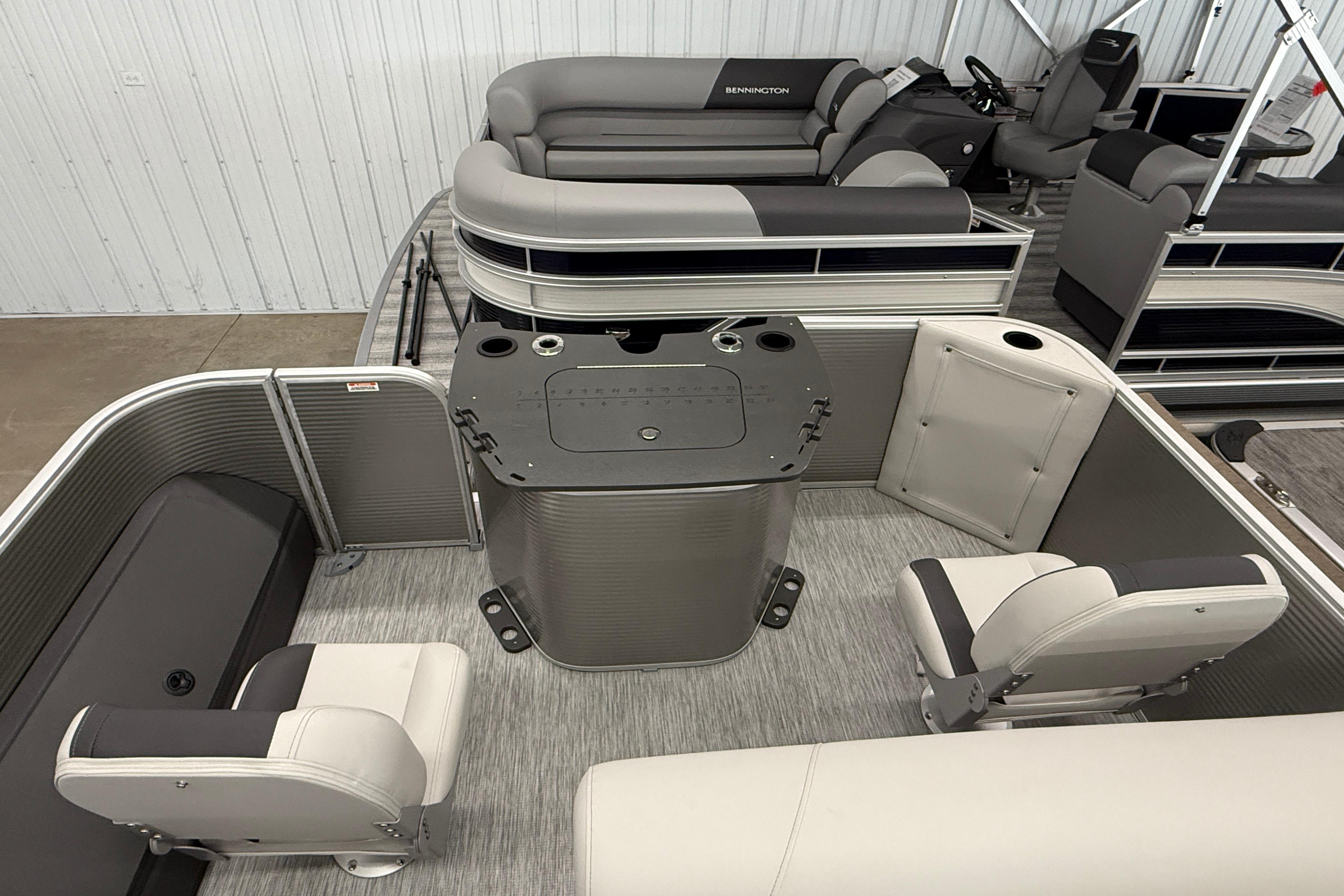 2026 Bennington 20 SF pontoon boat interior with seating and helm station.