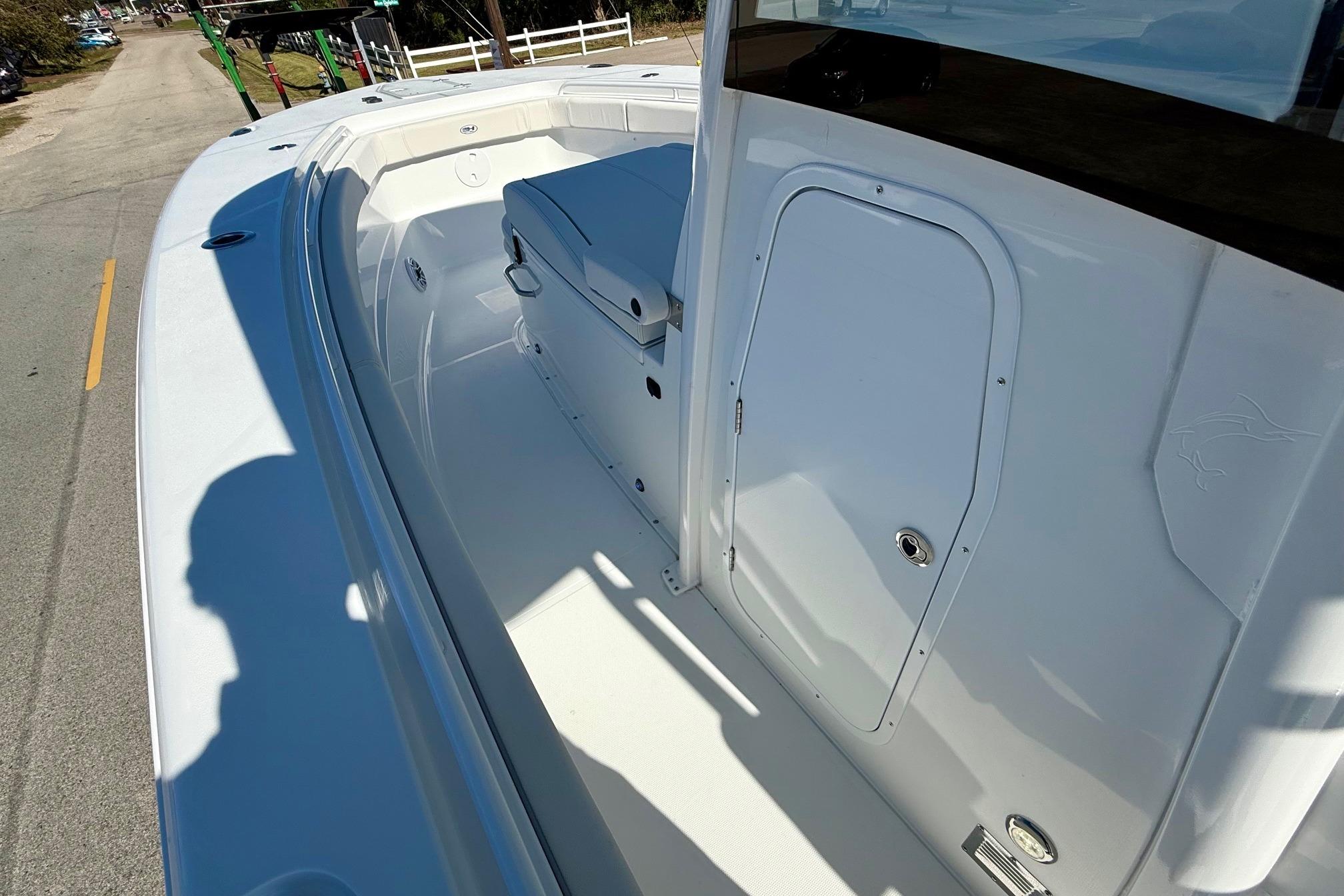 2026 Sea Hunt Gamefish 30 Coffin Box boat interior, featuring spacious deck and storage.