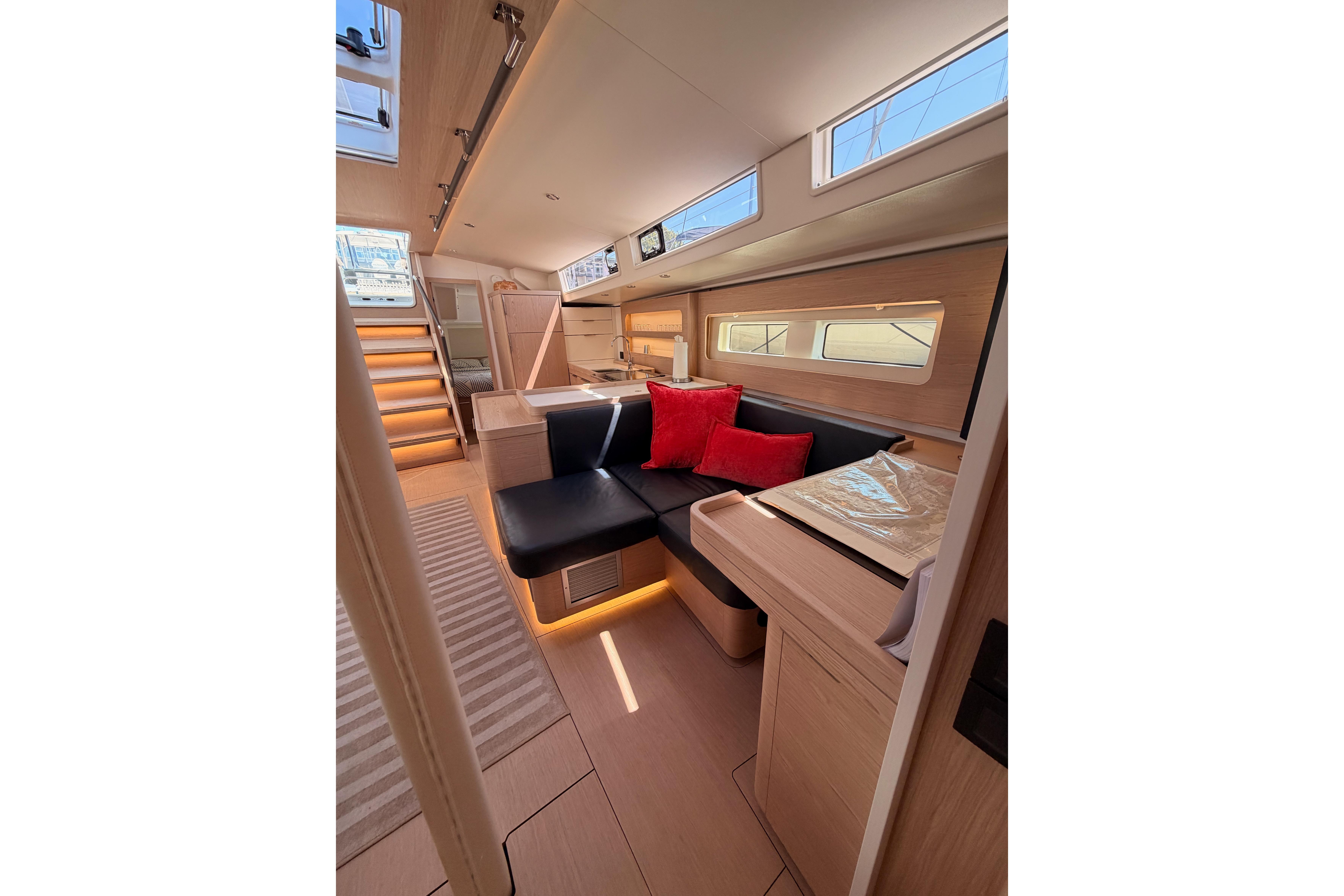 Luxurious interior of 2022 Beneteau Oceanis Yacht 54 with modern seating and elegant design.