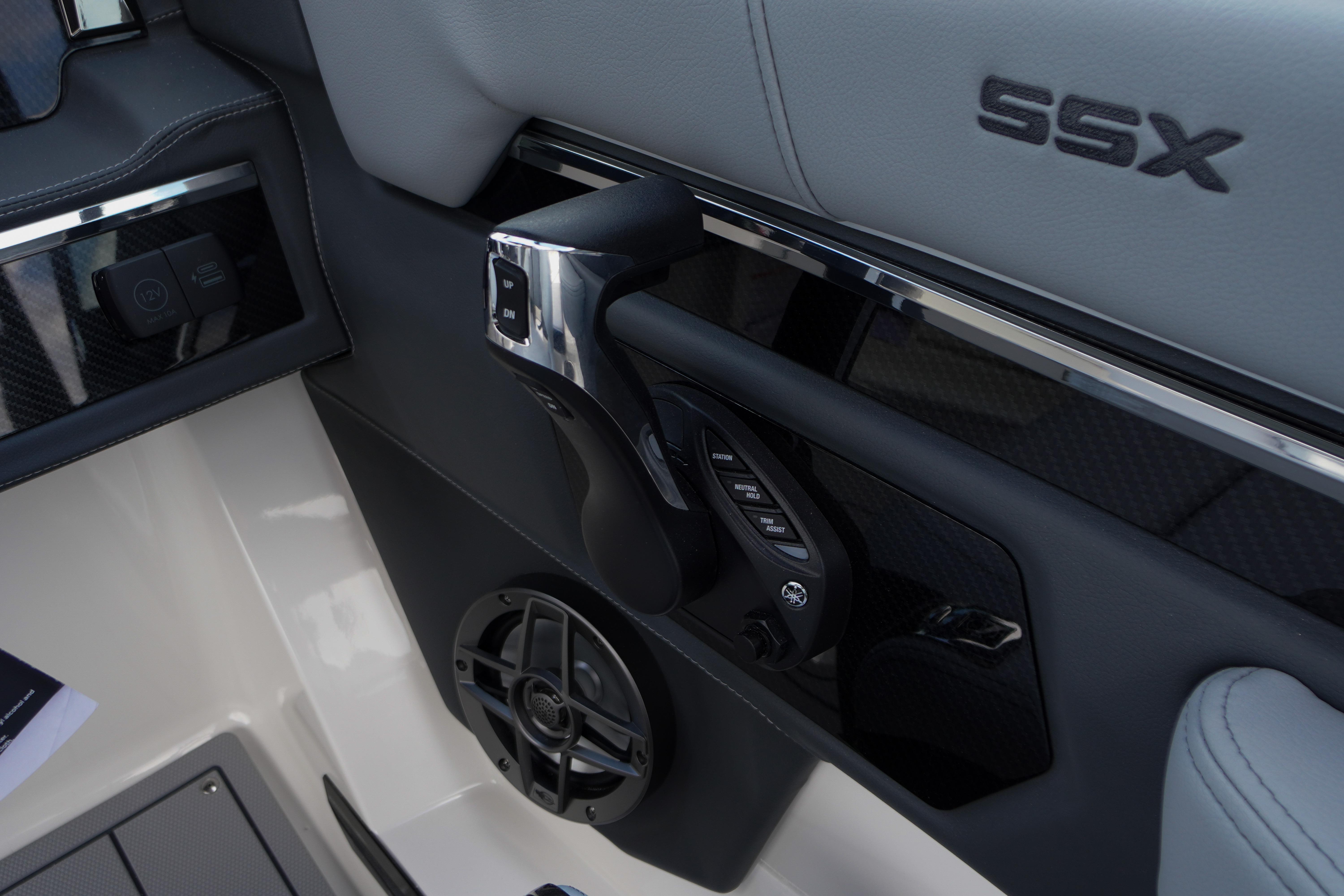 Interior view of 2026 Chaparral SSX 4 boat controls and speaker system.