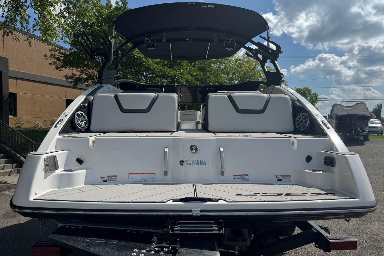 2023 Yamaha Boats 252XE rear view, showcasing sleek design and spacious seating.