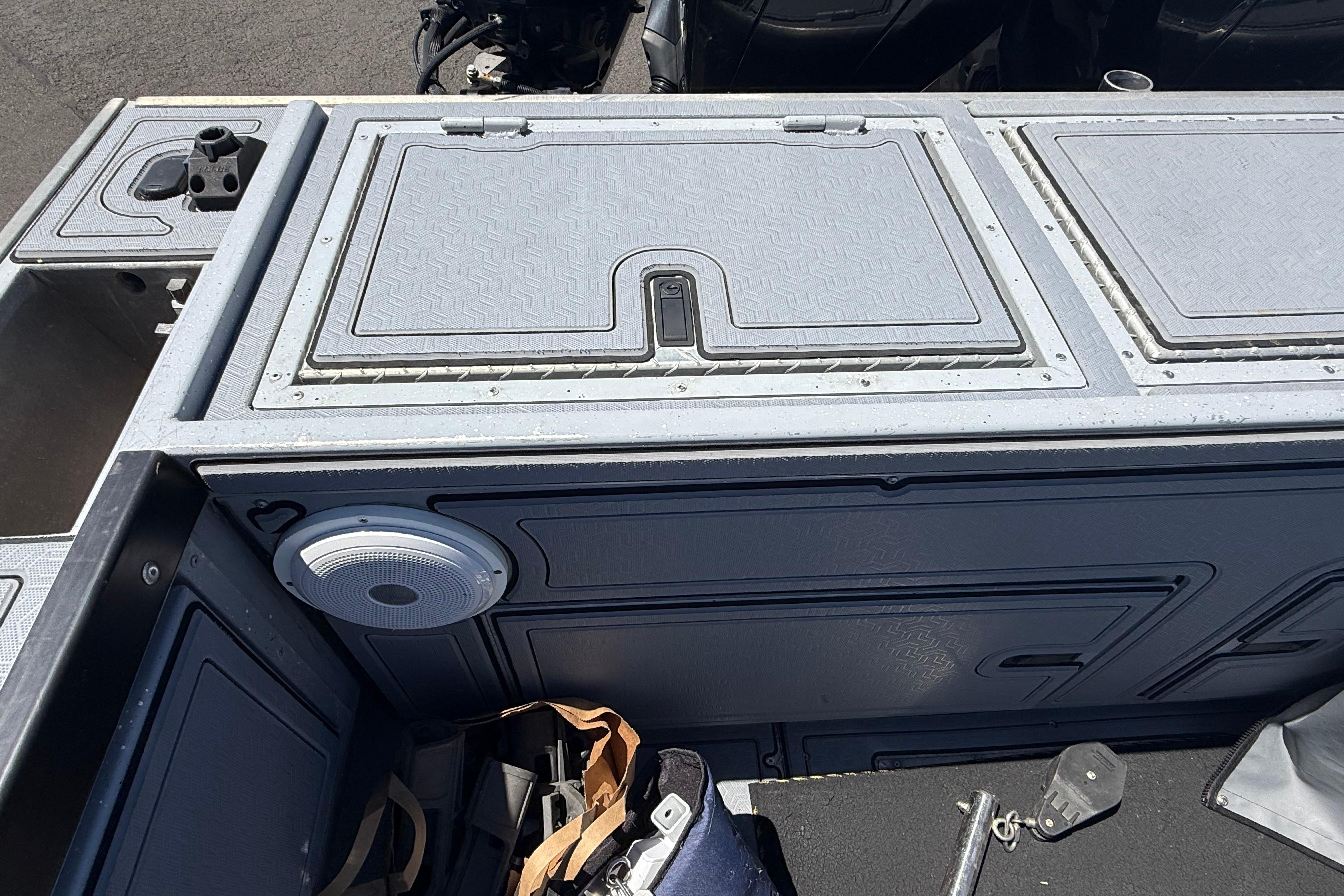 2015 Alumaweld Pacific XD 28 boat interior with storage compartments and speaker.