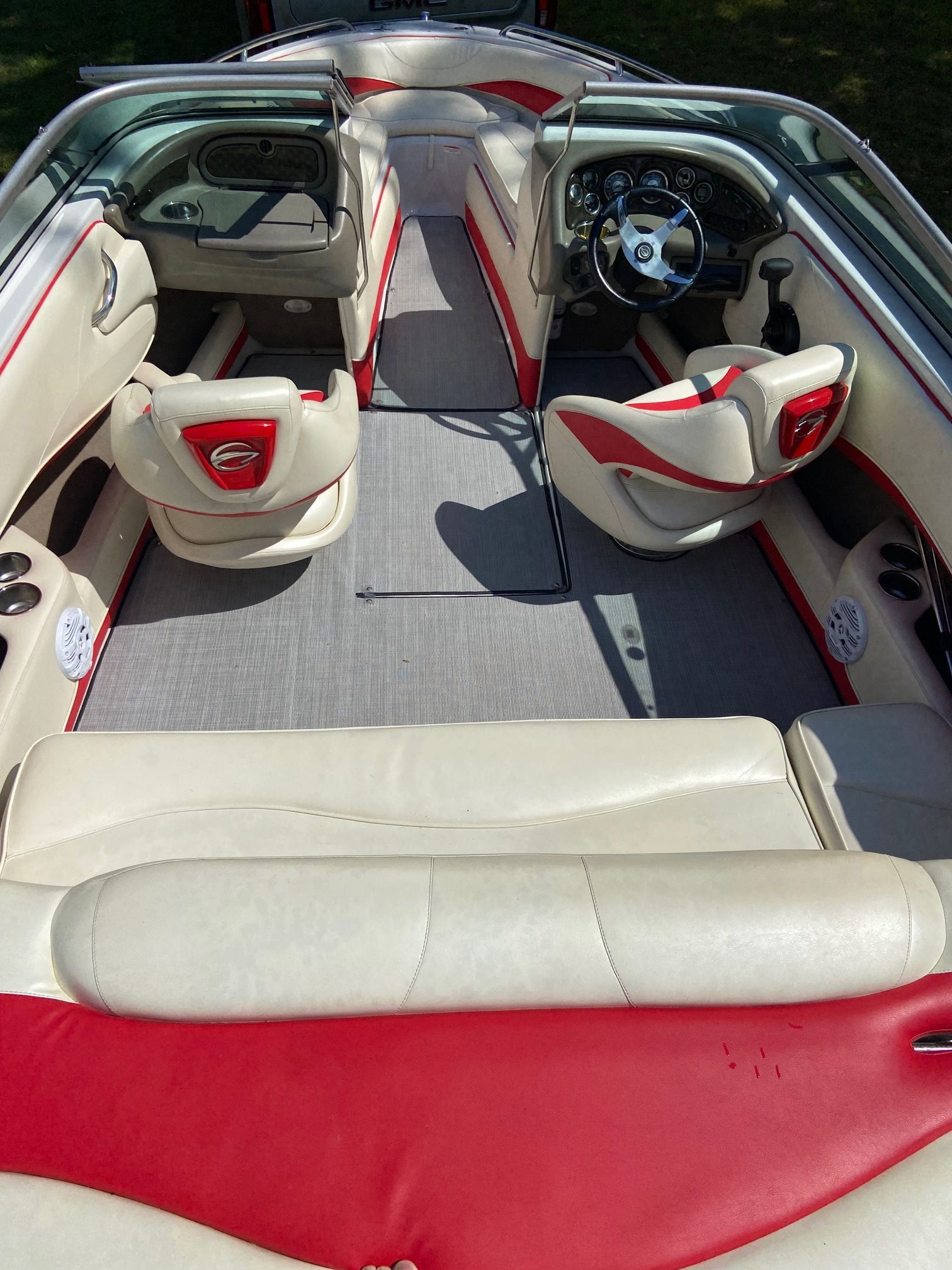Interior of a 2011 Crownline 21 SS boat with red and white seating.