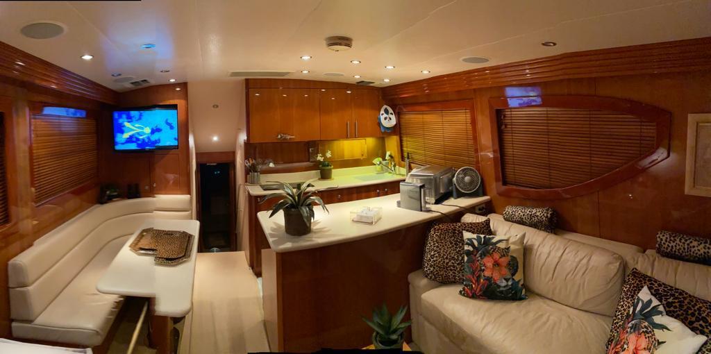 Luxurious interior of a 2005 Hatteras 50 Convertible yacht with modern amenities.