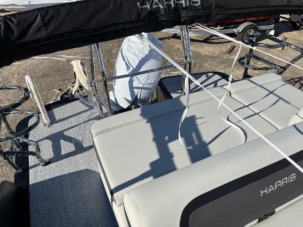 2025 Harris Cruiser 230 boat interior with seating and railing, featuring a sleek design.