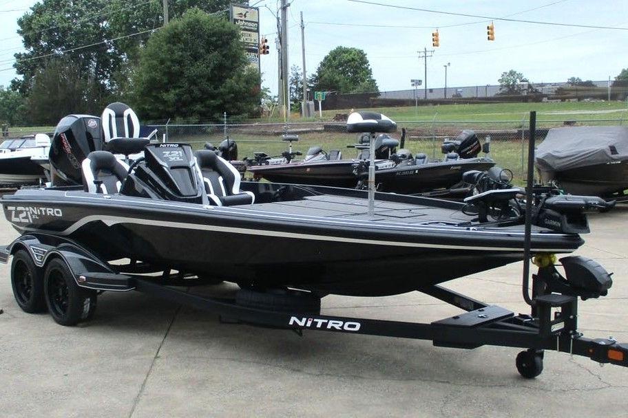 2026 Tracker Pro Guide V-16 WT boat on trailer in outdoor setting.