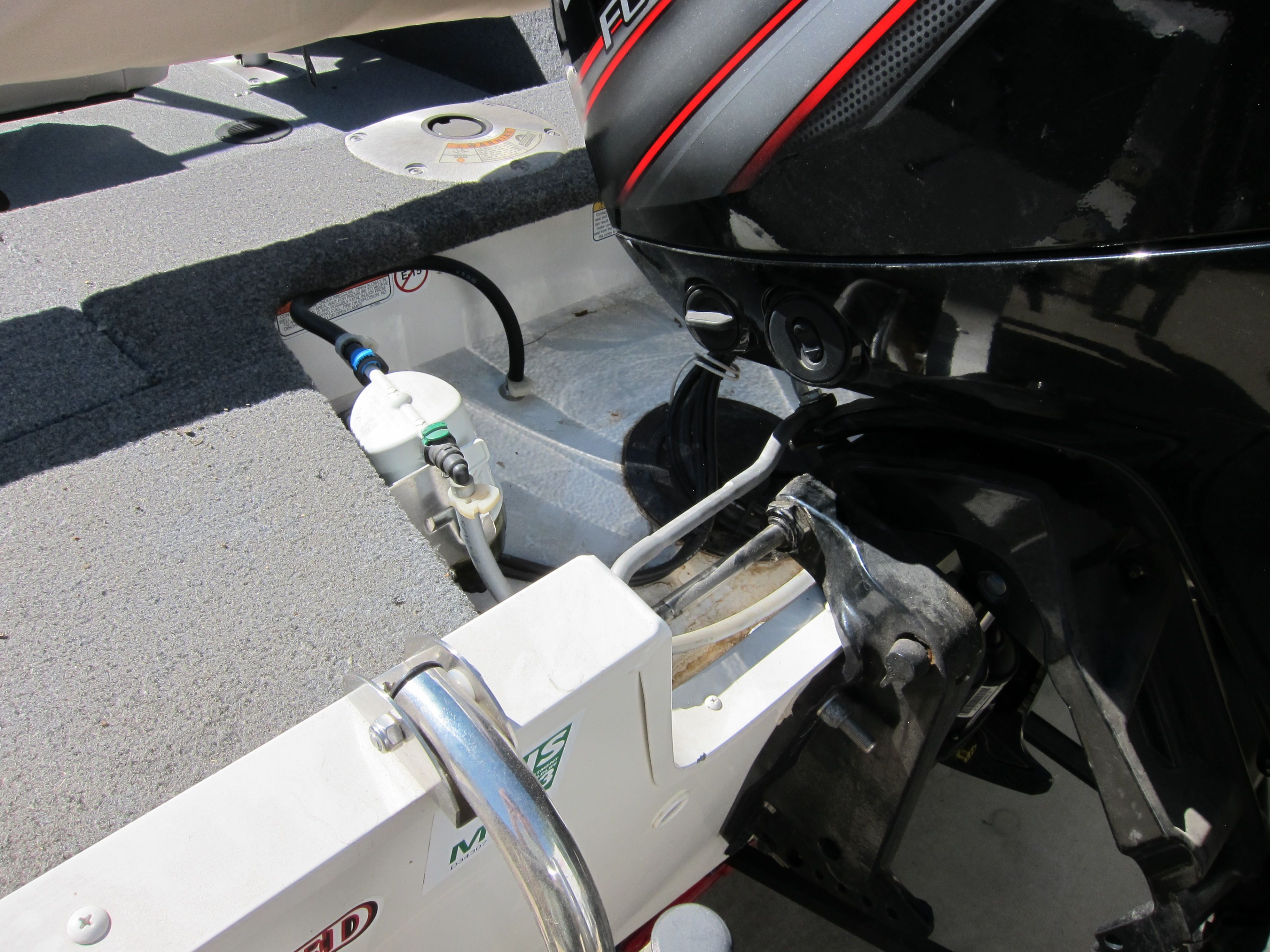 Close-up of the engine area of a 2018 Tracker Pro Guide V-16 WT boat.