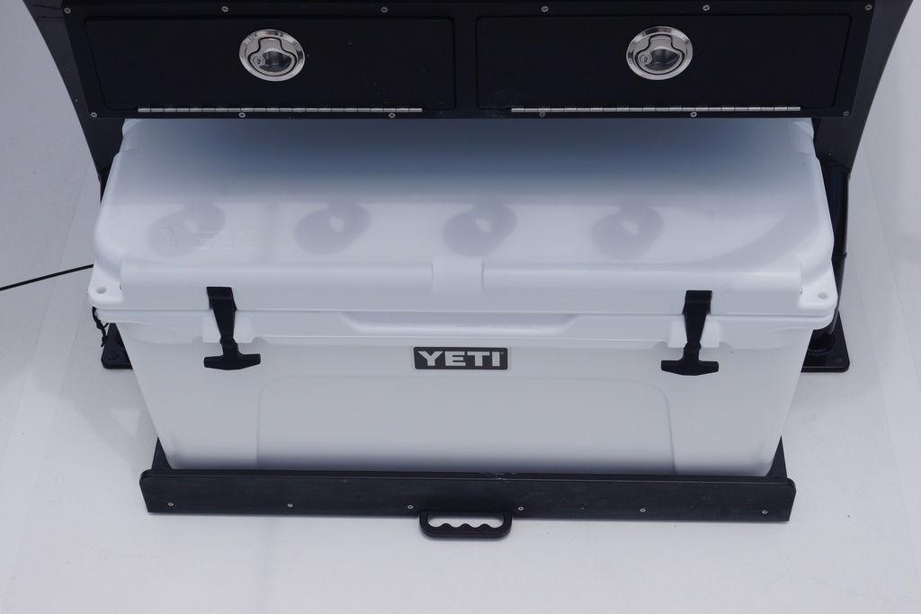 YETI cooler stored under Tidewater 2500 Carolina Bay boat console, 2027 model.