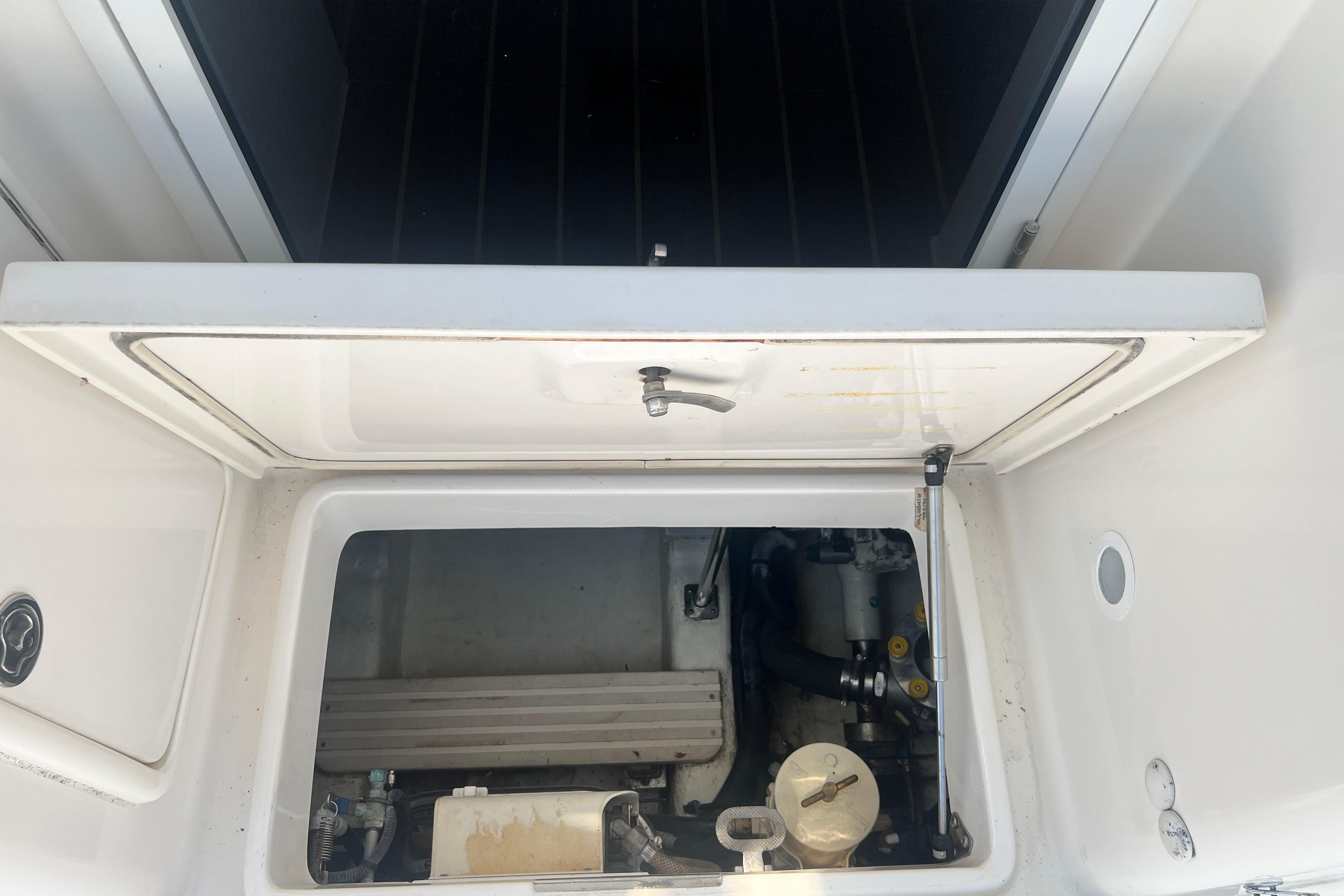 Engine compartment of a 2007 Riviera 33 Flybridge boat, showcasing mechanical components.