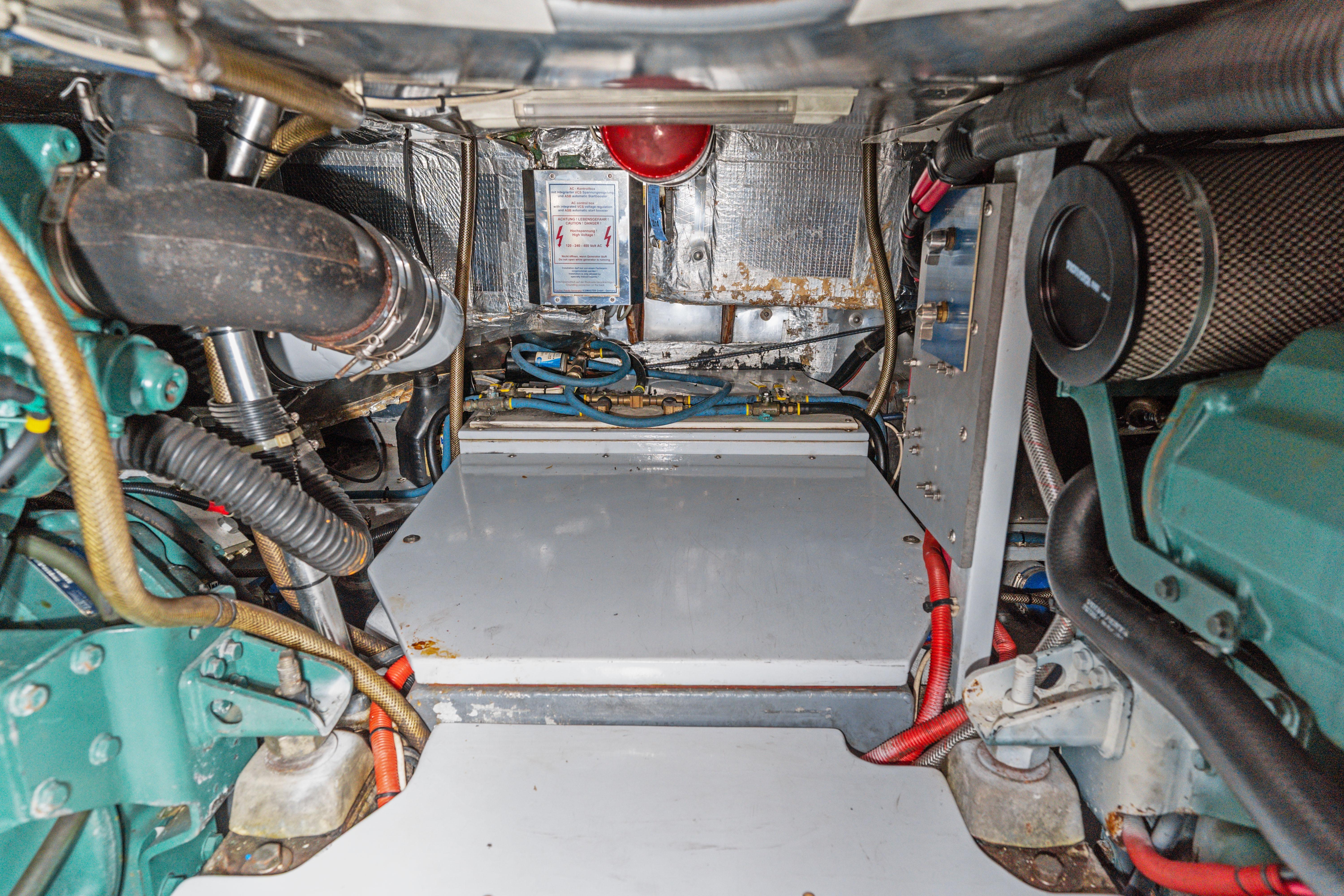 Engine room of a 1999 Able 44 boat, showcasing mechanical components and wiring.