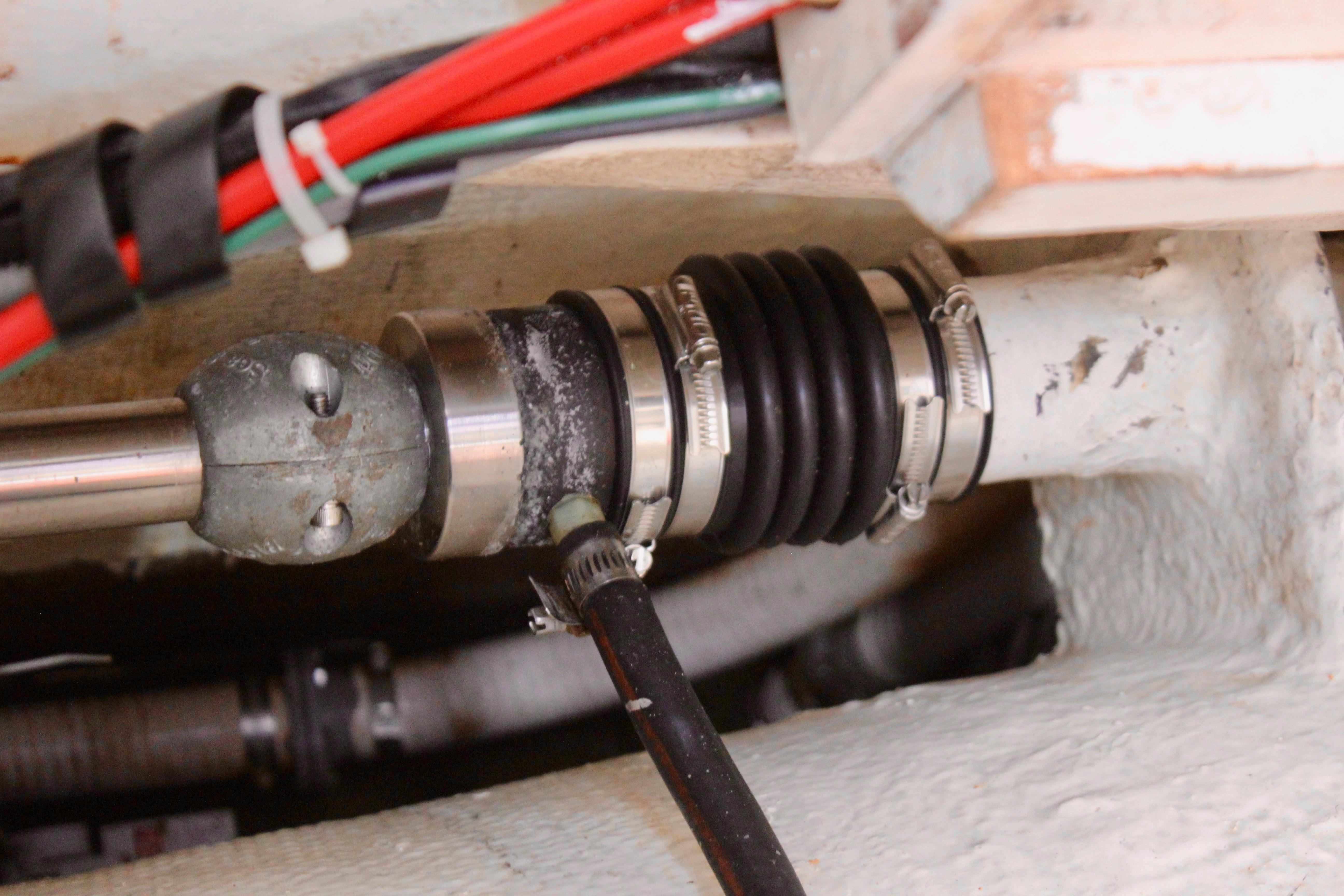 Close-up of a Freya 39 sailboat's shaft seal system, featuring clamps and wiring, 1993 model.