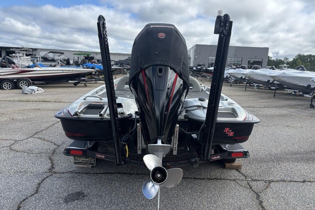 2020 Bass Cat Cougar FTD boat, rear view with motor and propeller, parked outdoors.