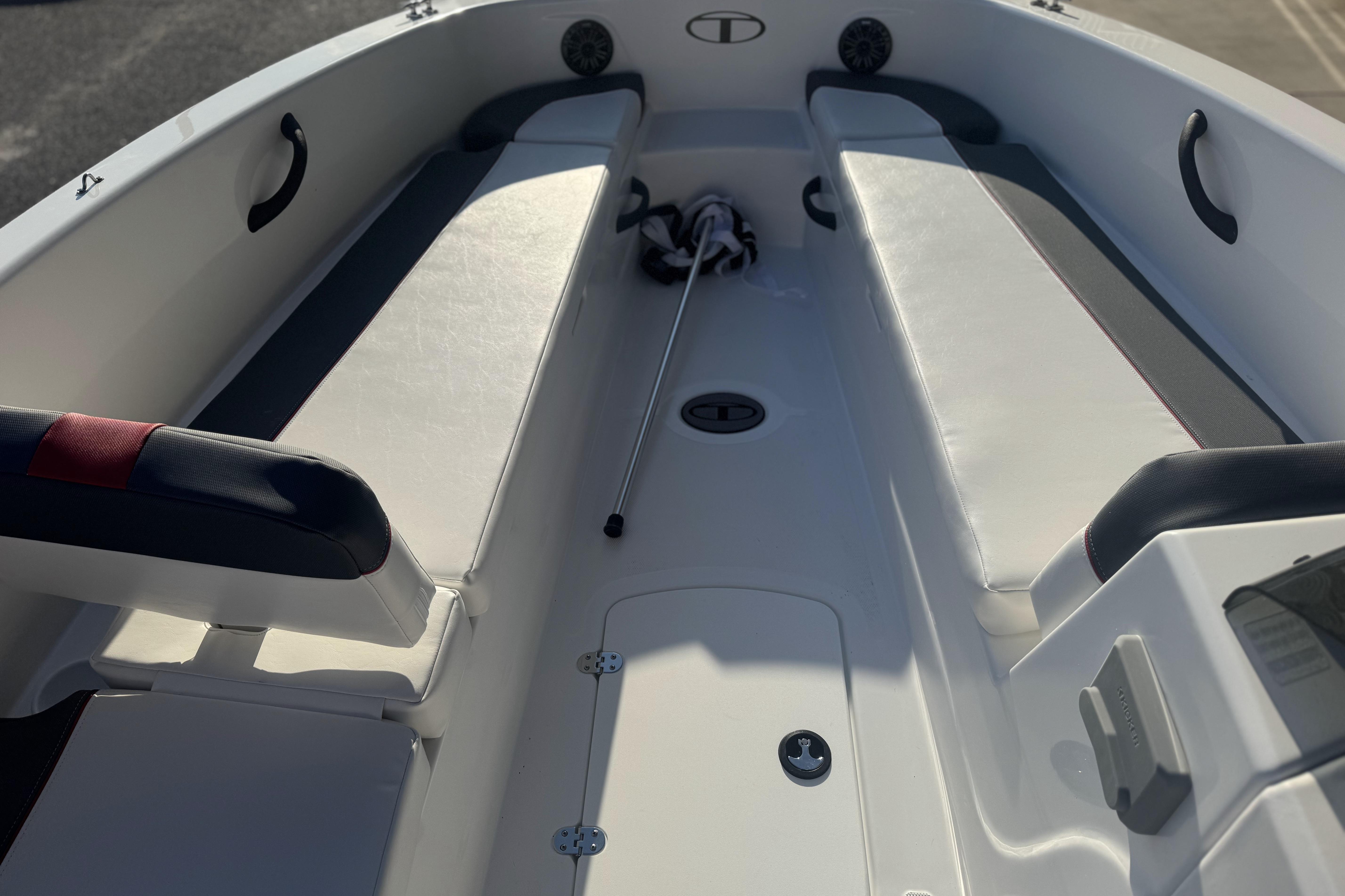 Interior view of a 2026 Tahoe T18 boat, featuring seating and storage compartments.