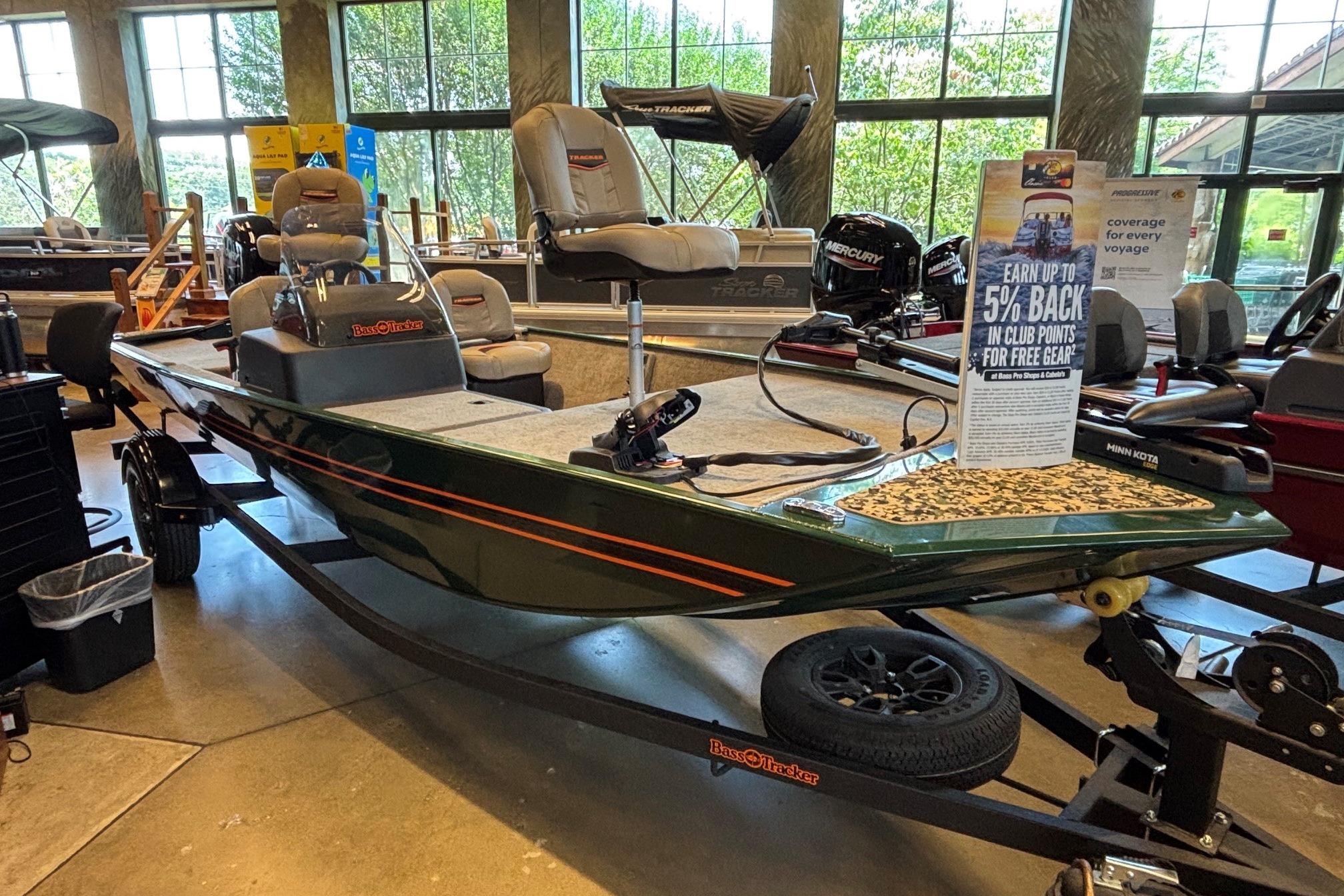 2026 Tracker Bass Tracker Classic Limited boat displayed indoors with promotional signage.