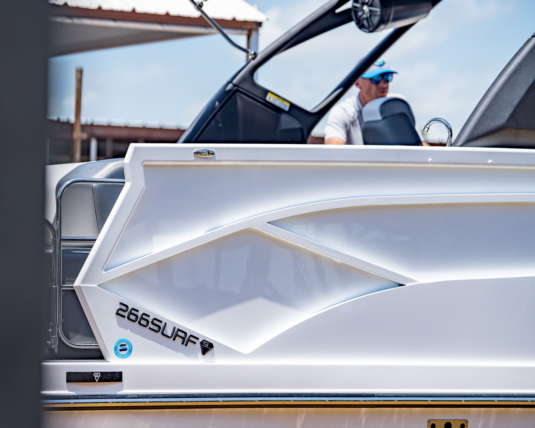 2025 Paradigm 266 SL SURF boat, modern design, side view.