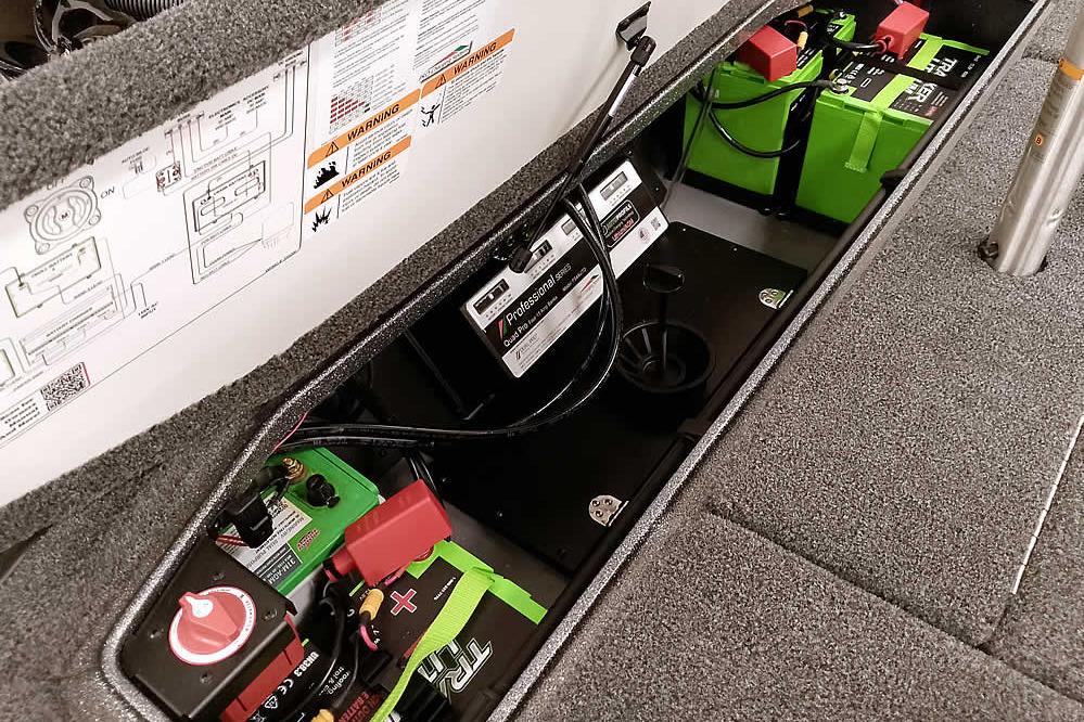 Battery compartment of 2026 Ranger Z519R Cup-Equipped boat, featuring multiple batteries and wiring.