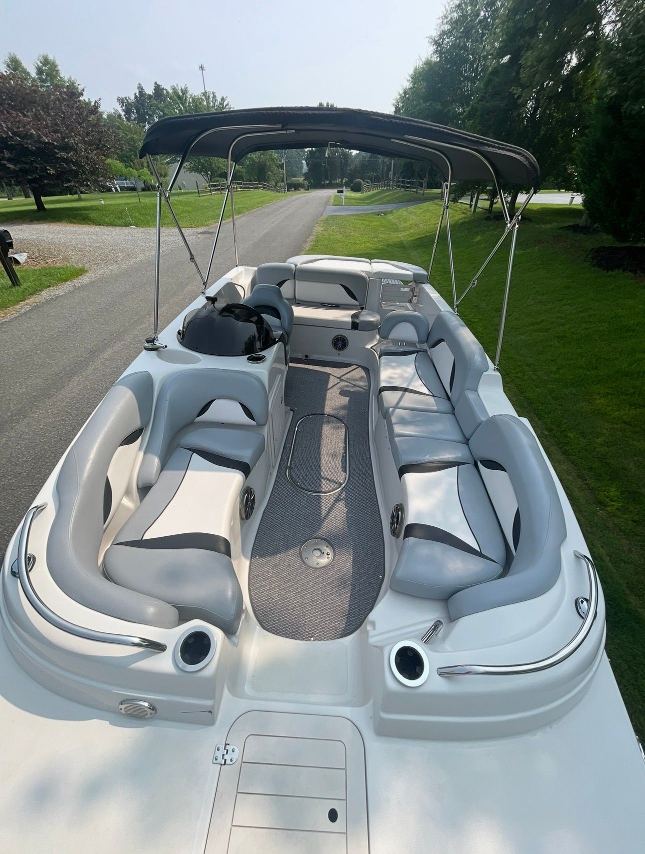 2015 Starcraft Star Step 220 I/O boat parked on road.