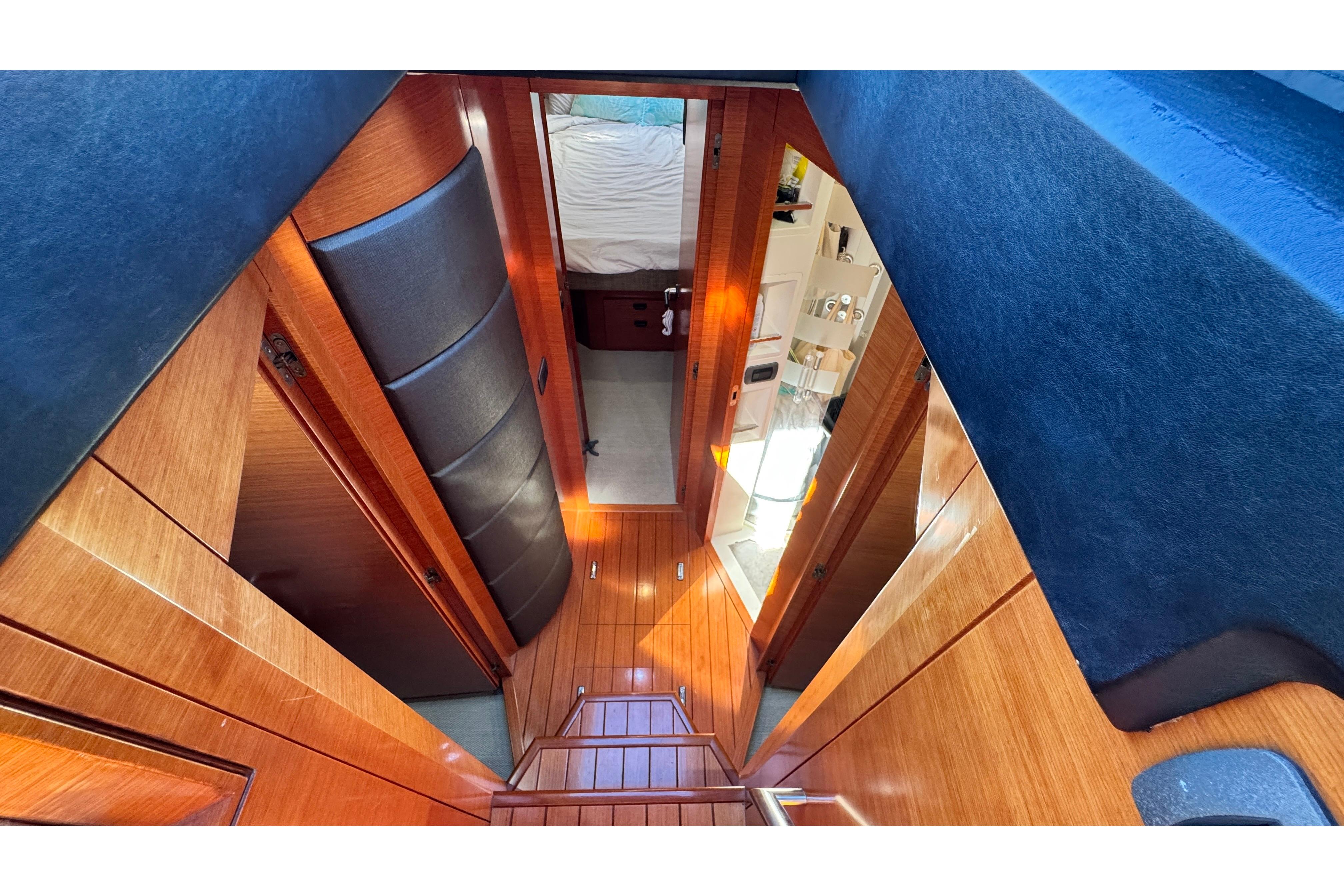 Luxurious interior of 2007 Doma 5 yacht with wood paneling and modern design.