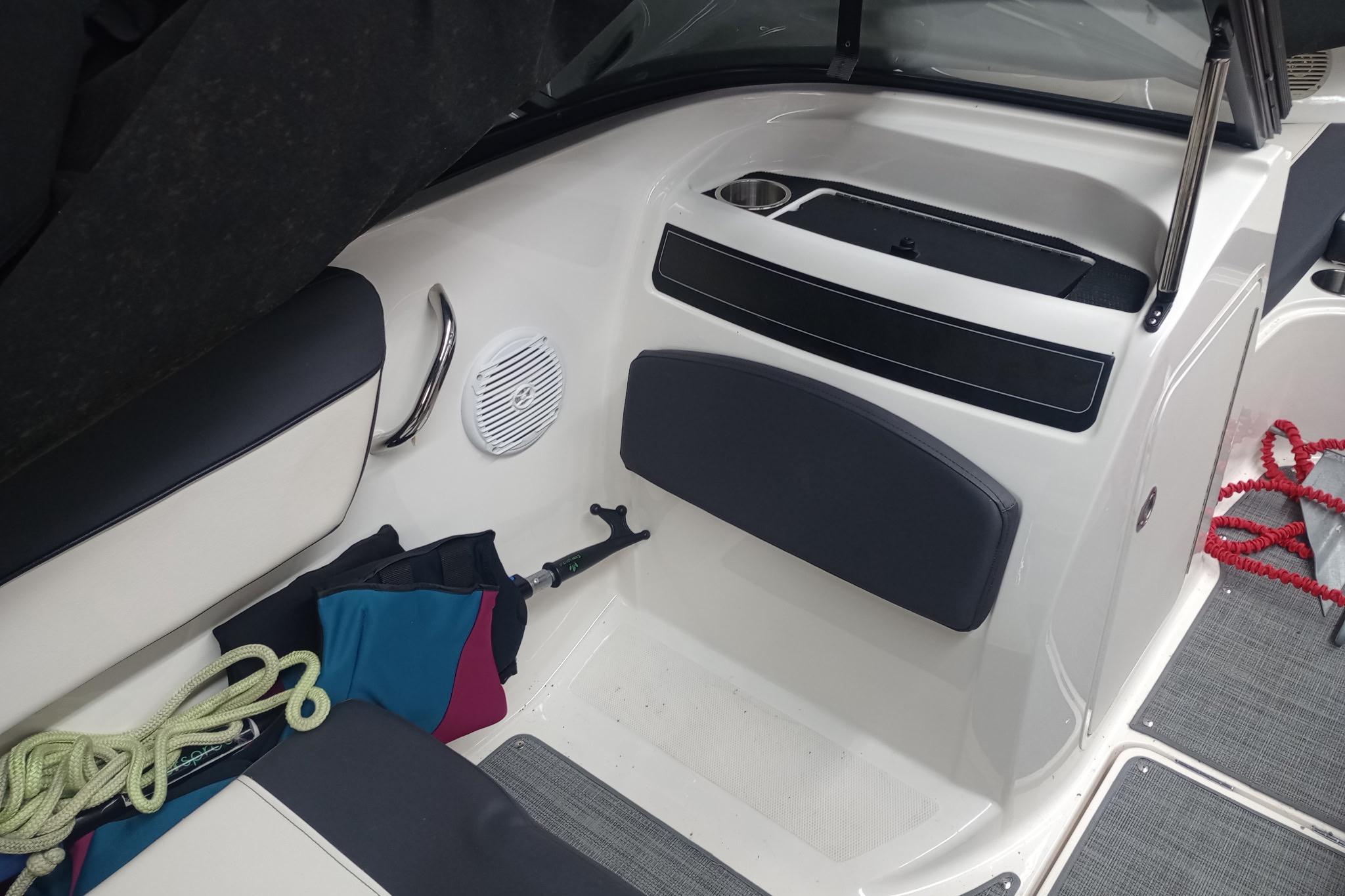 2022 Bayliner VR5 Bowrider I/O interior with seating, ropes, and storage compartments.