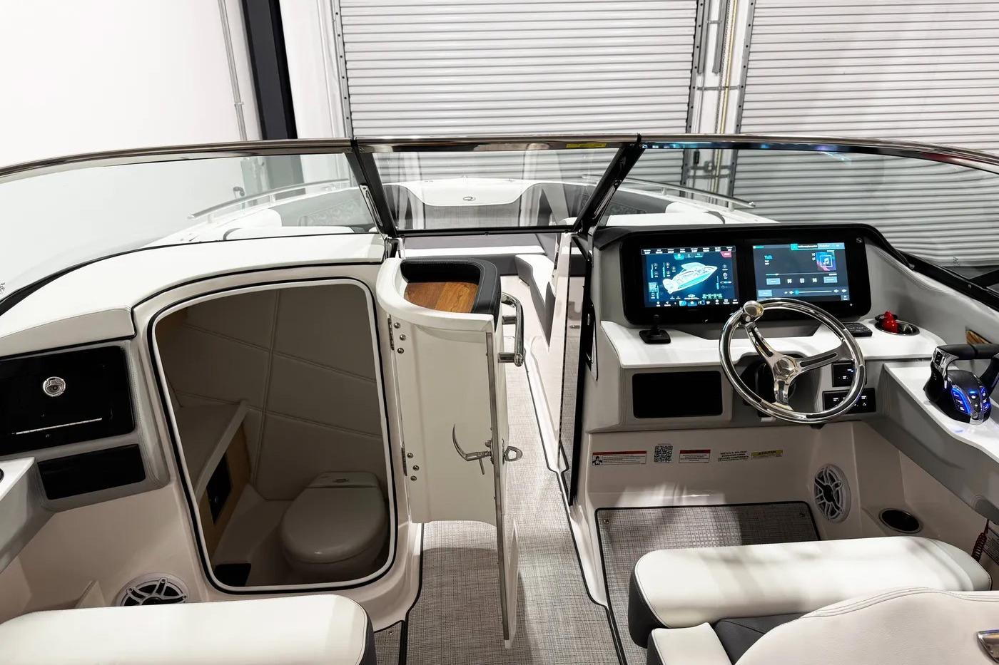 Interior of 2026 Regal LX9 boat with modern dashboard and cabin area.