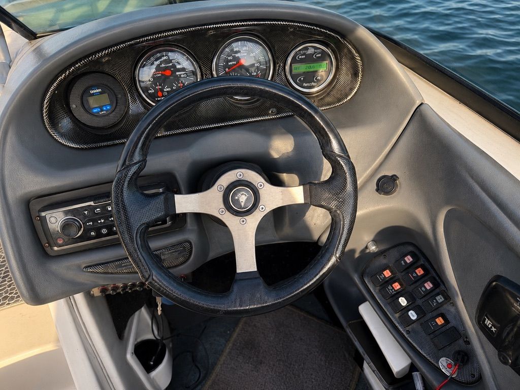 Dashboard of a 2003 Centurion Avalanche boat on water.