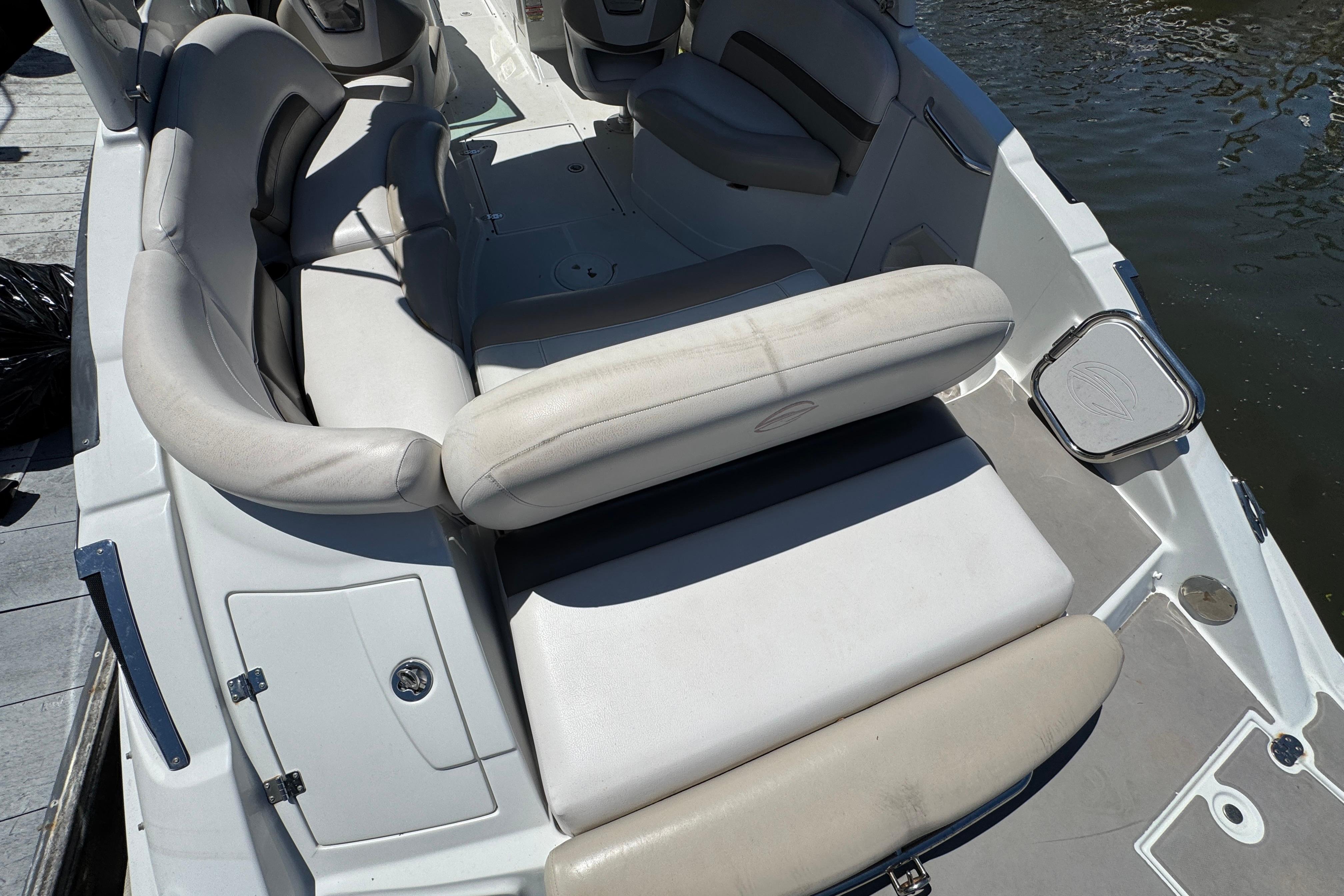 2013 Crownline Eclipse E6 XS boat interior with white seating and water view.