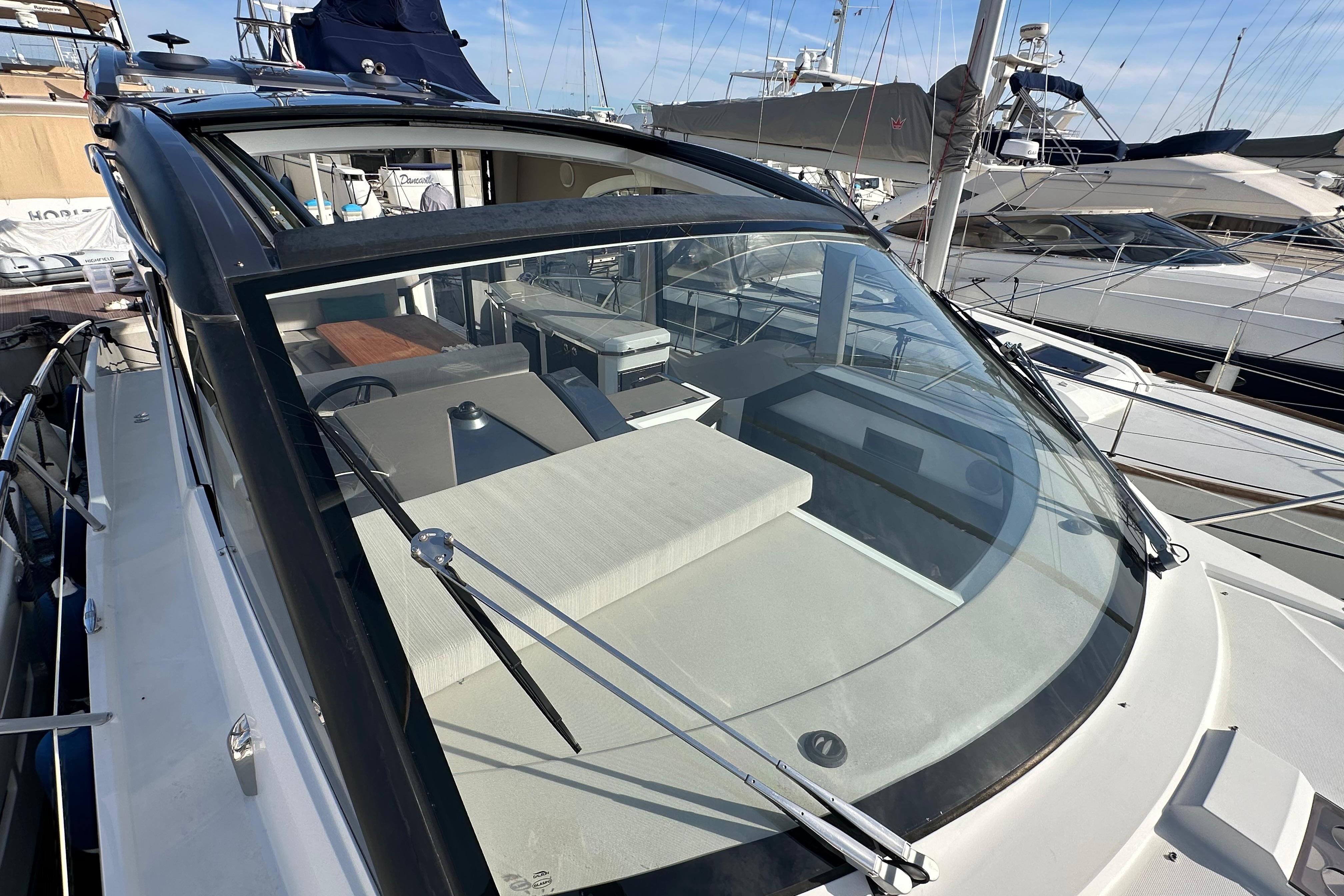 2018 Galeon 425 HTS yacht with sleek design, docked at marina.